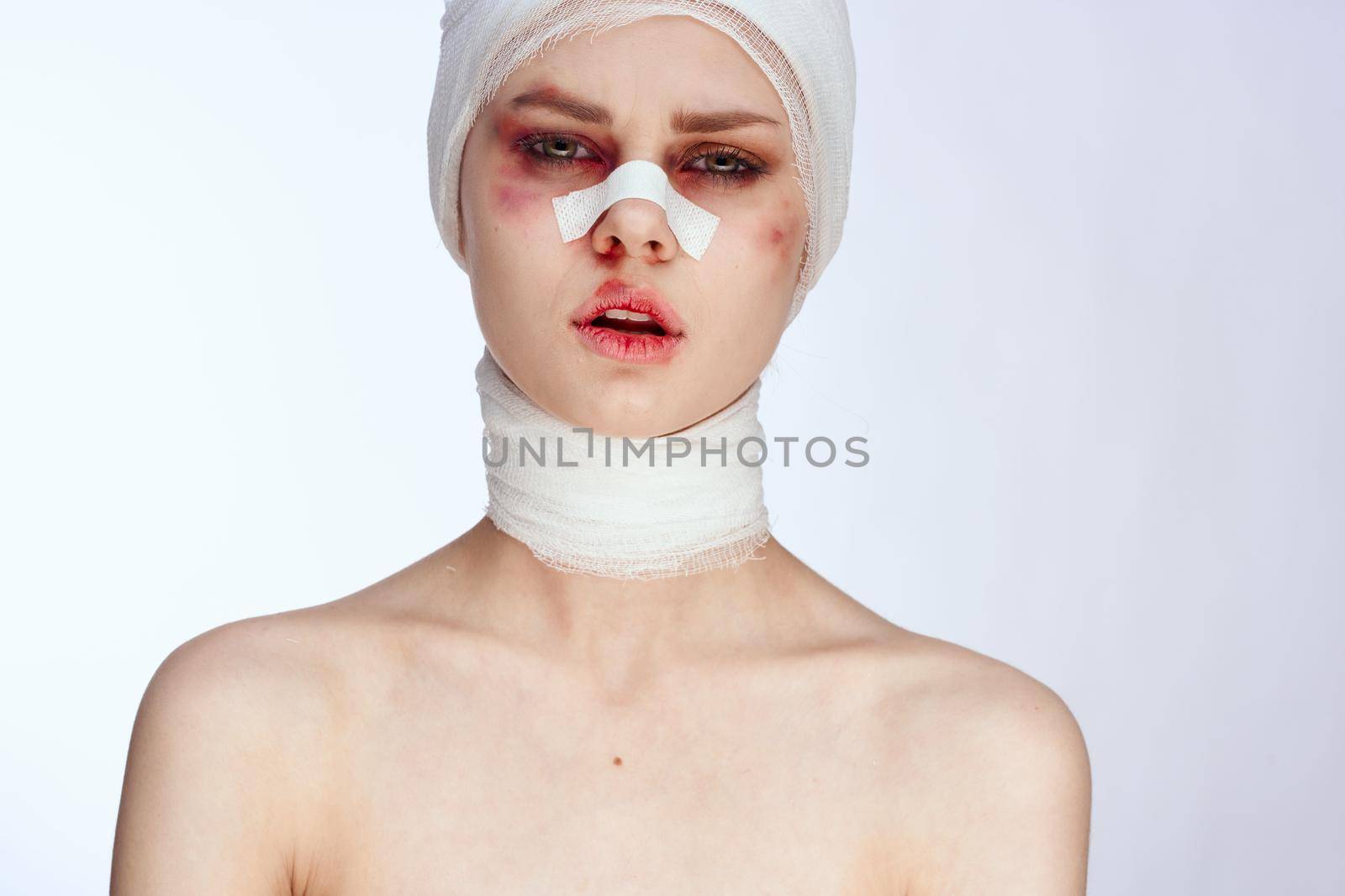 a person plastic surgery operation bare shoulders light background. High quality photo