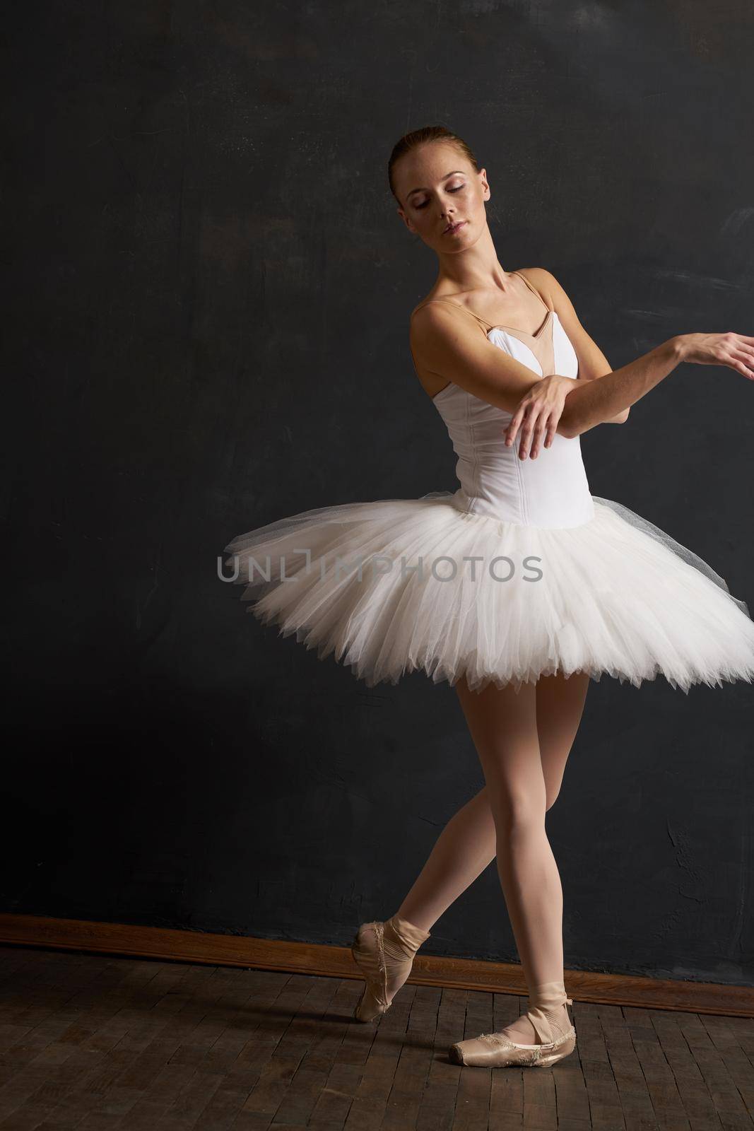 woman ballerina in white tutu performance grace dance. High quality photo