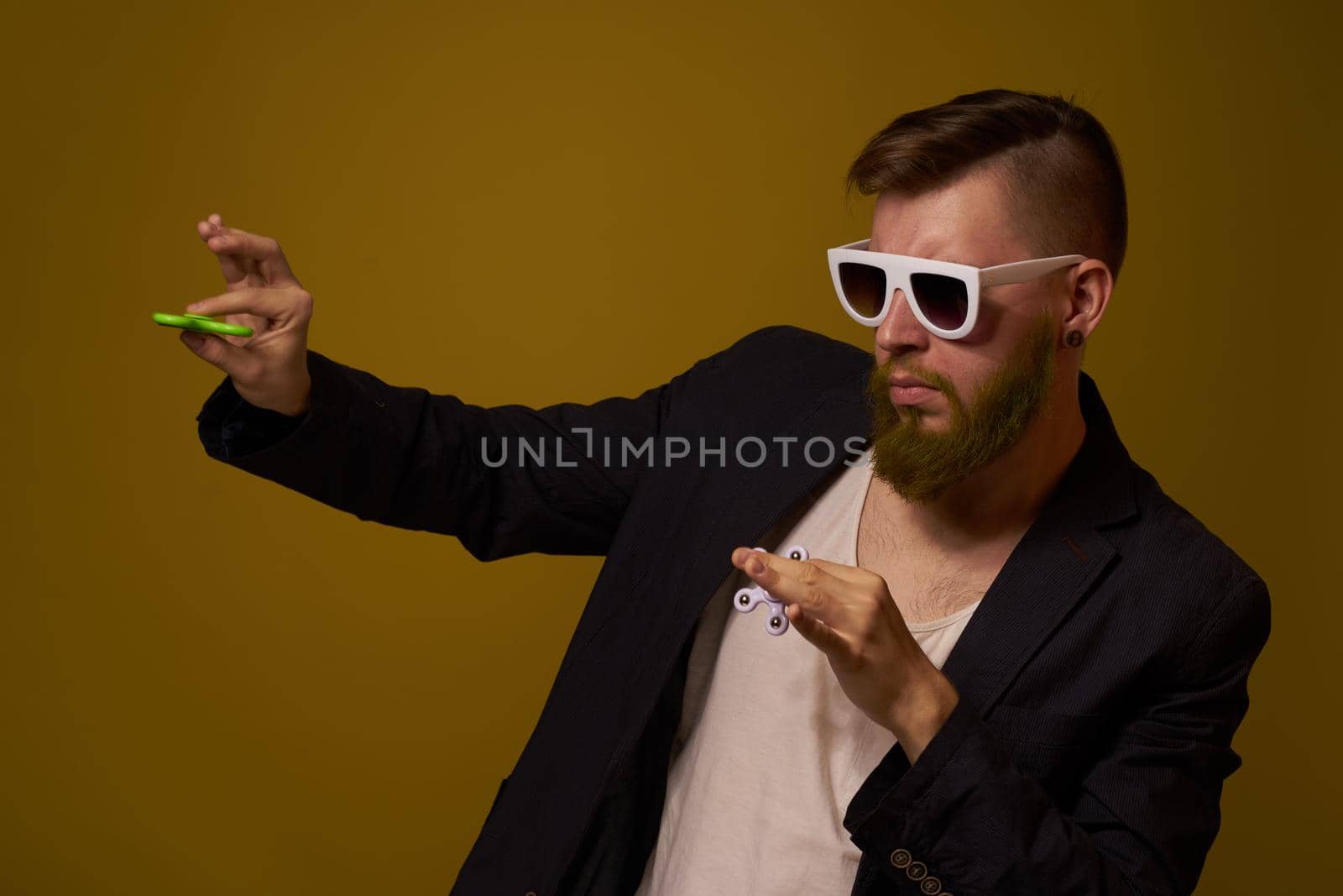 man wearing sunglasses spinner in hands fashion posing black jacket by Vichizh