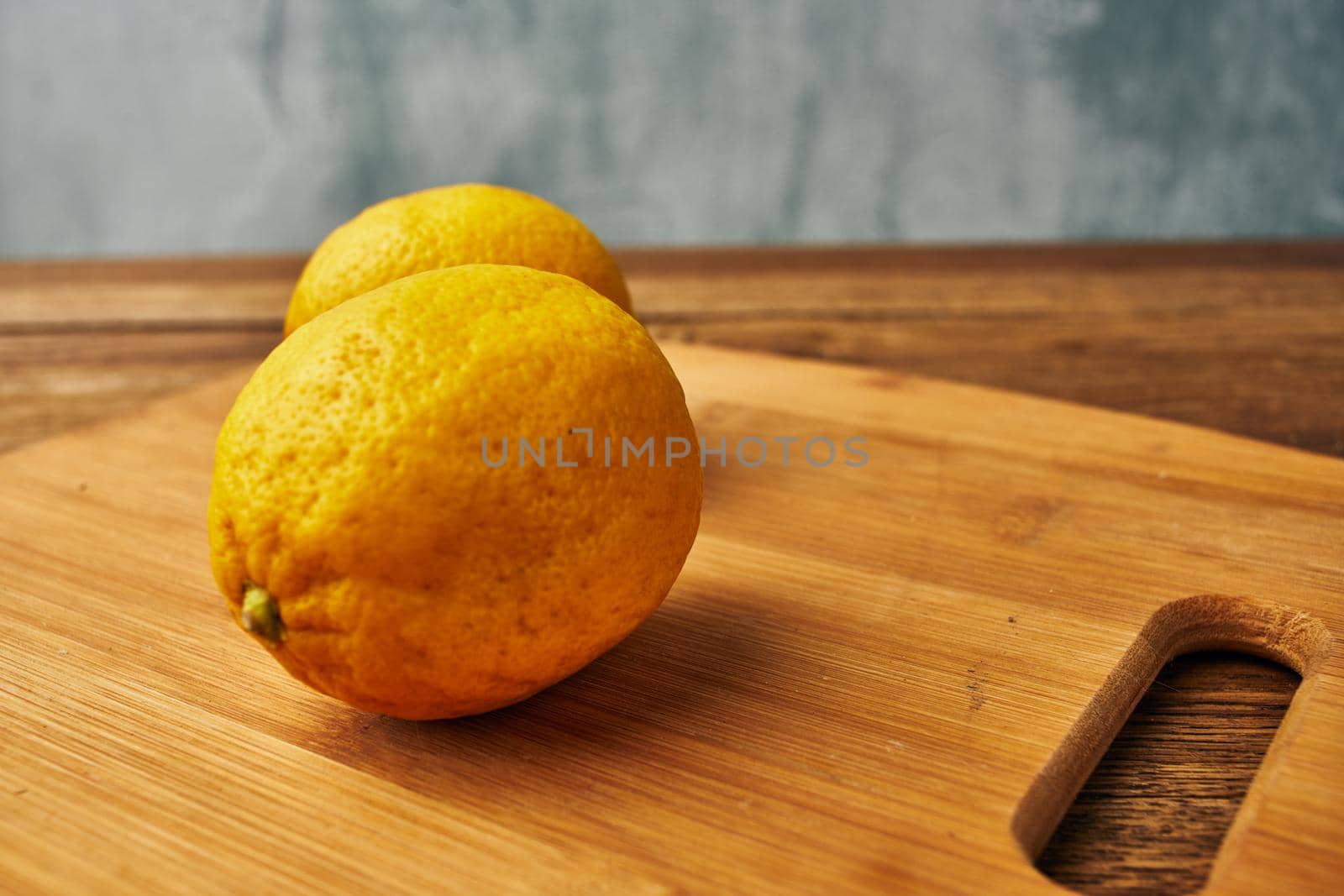 yellow lemon cutting board kitchen fresh food. High quality photo
