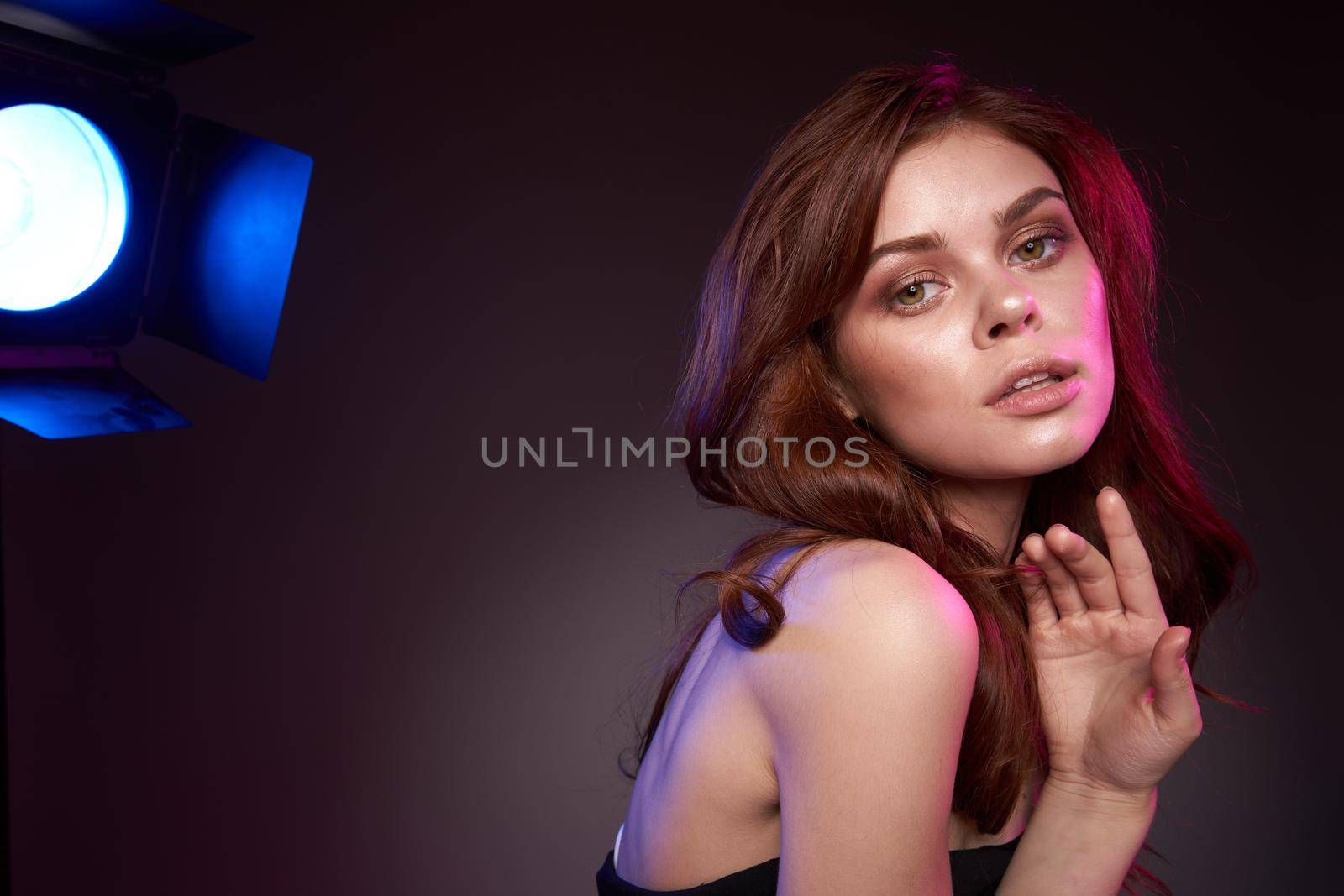 portrait of a woman shooting photography studio posing light close-up. High quality photo