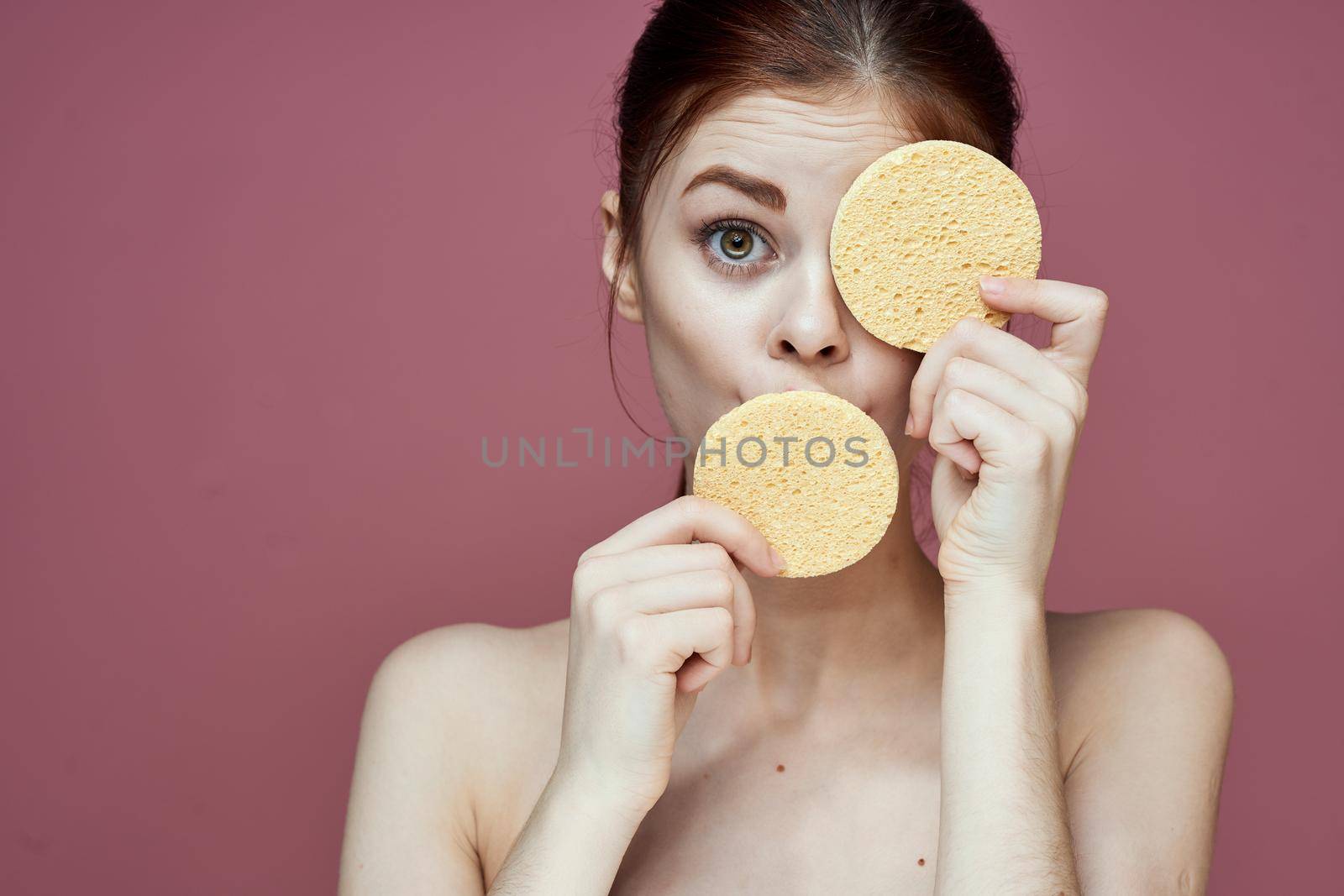 woman with bare shoulders sponge in hands clean skin hygiene by Vichizh