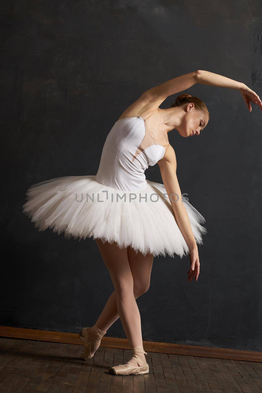 woman ballerina in white tutu performance grace dance. High quality photo