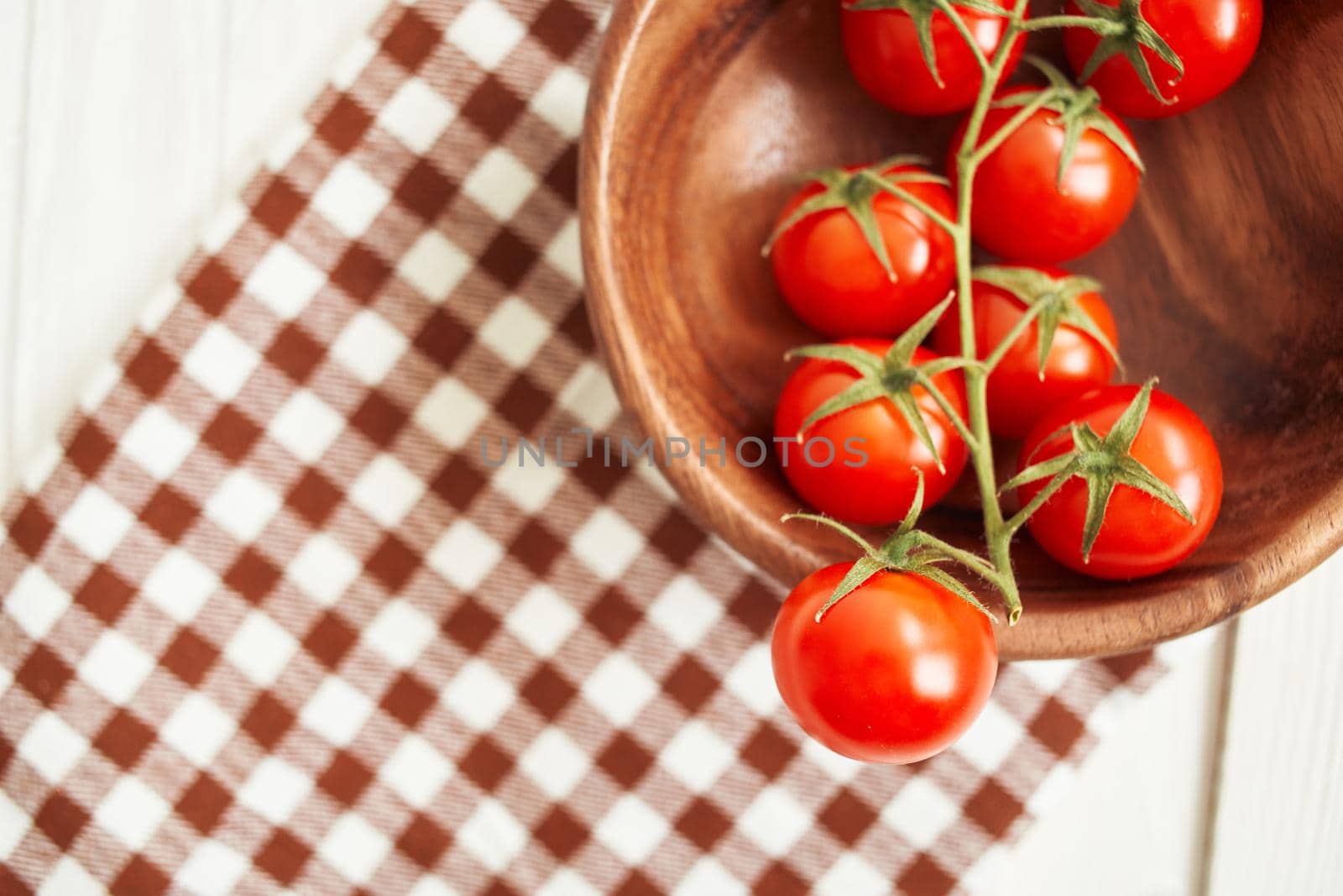vegetables Cherry tomatoes on a cutting board wood background by Vichizh