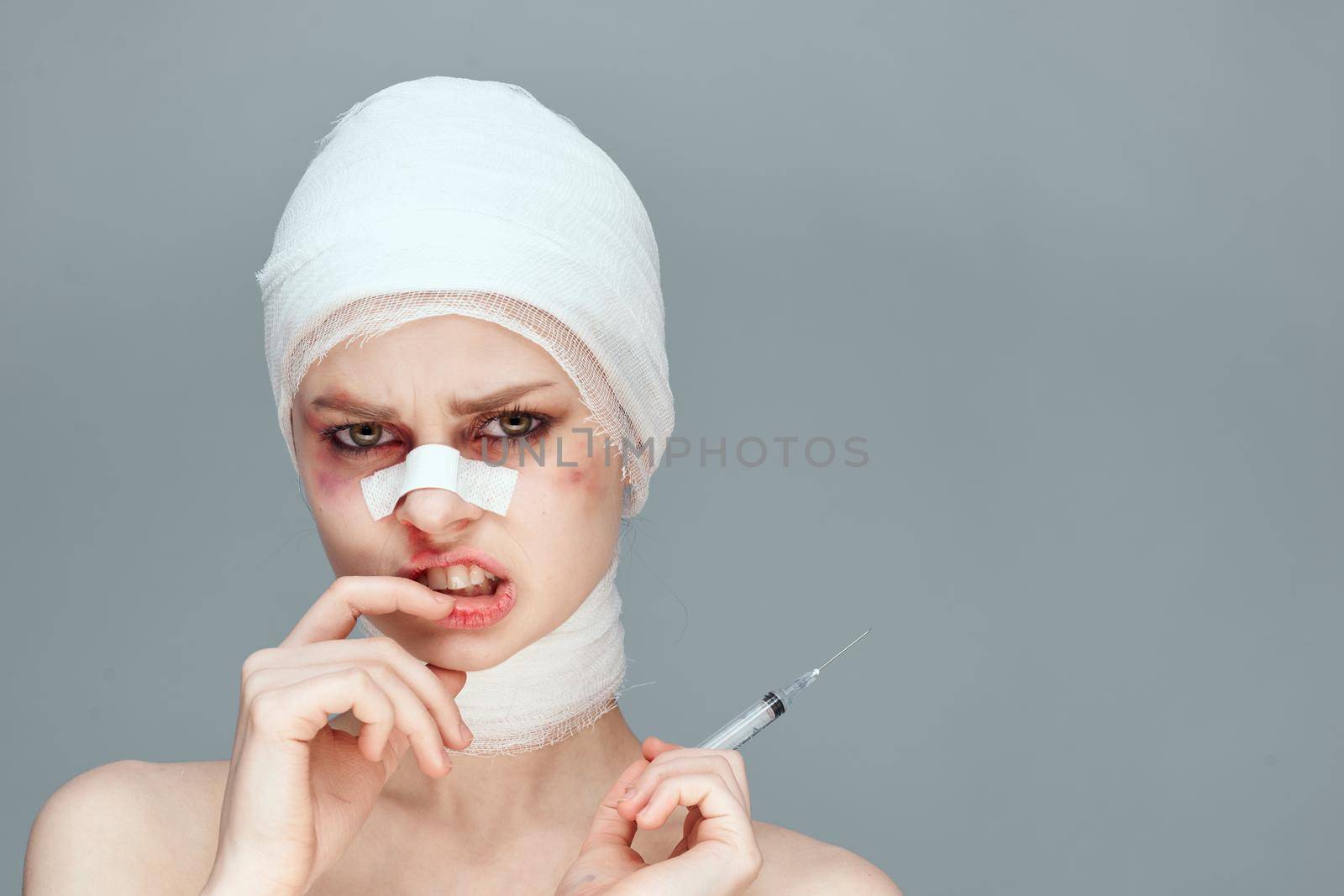 female patient bandaged face health problems isolated background by Vichizh
