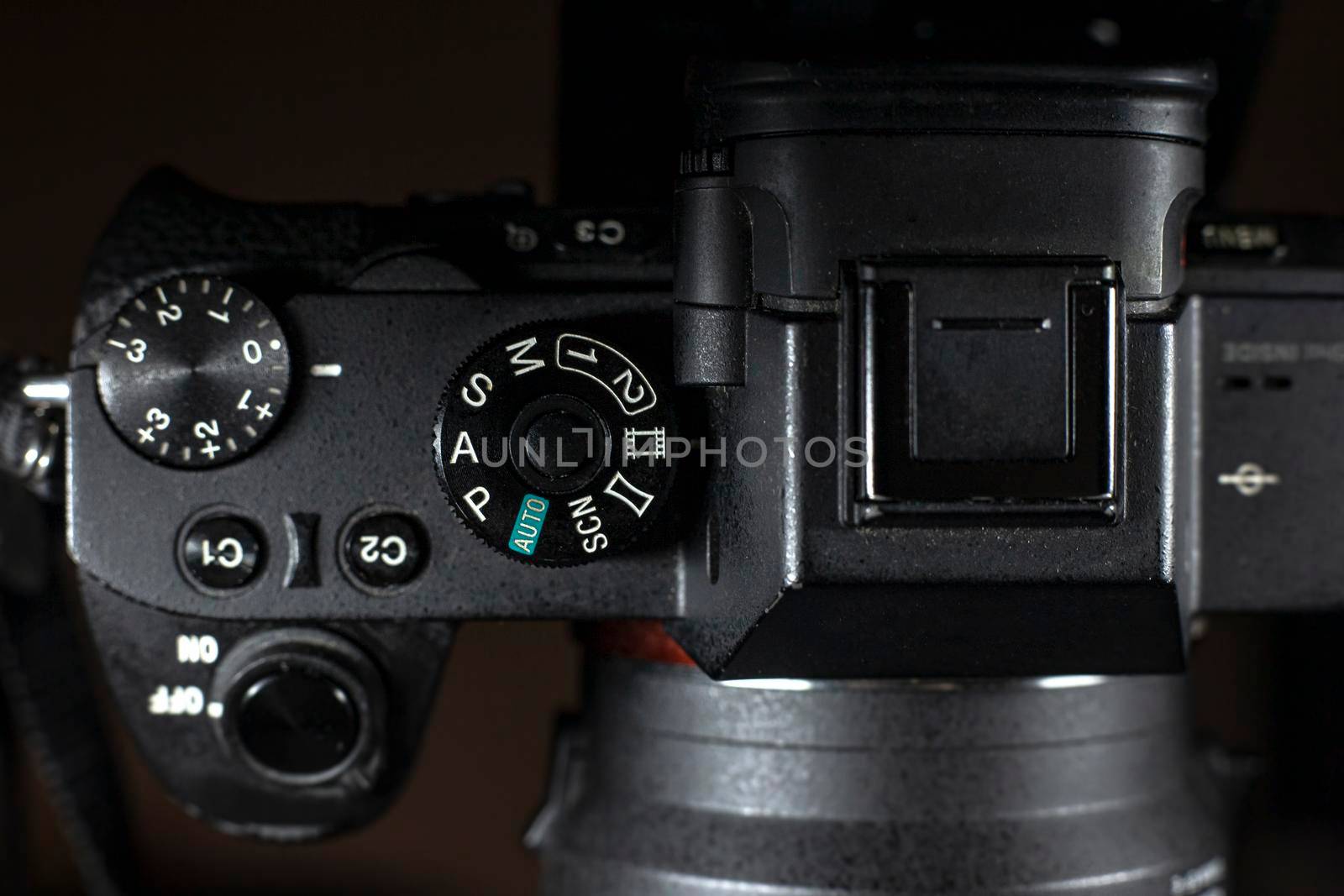 Shutter Speed dial of a digital camera in black background.
