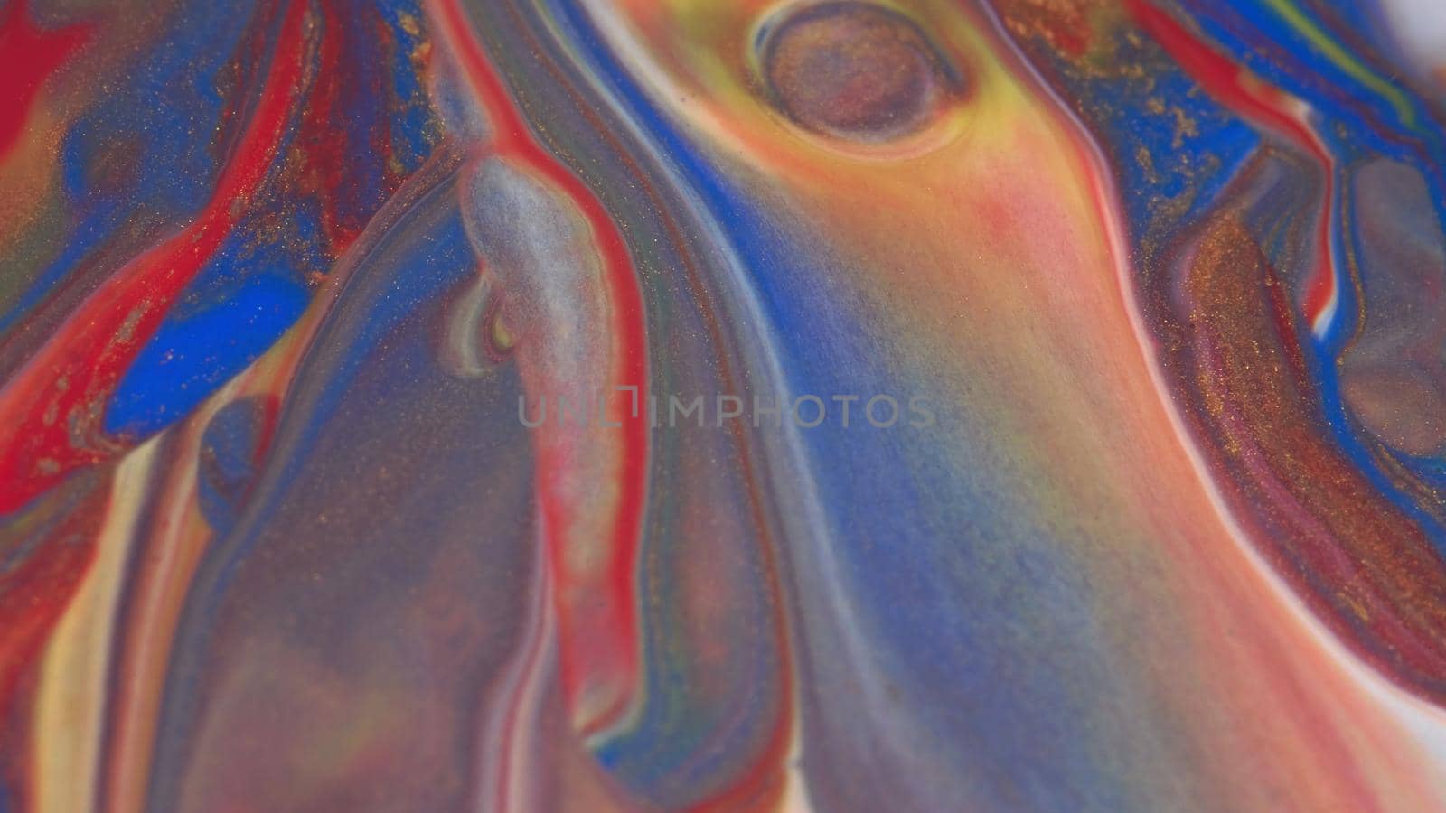 Abstract colorful background of spreading colors. Abstract red paint background. Acrylic texture with marble pattern. Abstract-ART. Natural luxury. The style includes the vortices of marble or the ripples. Very beautiful red, black, yellow, gray, blue paint with the addition of gold powder.