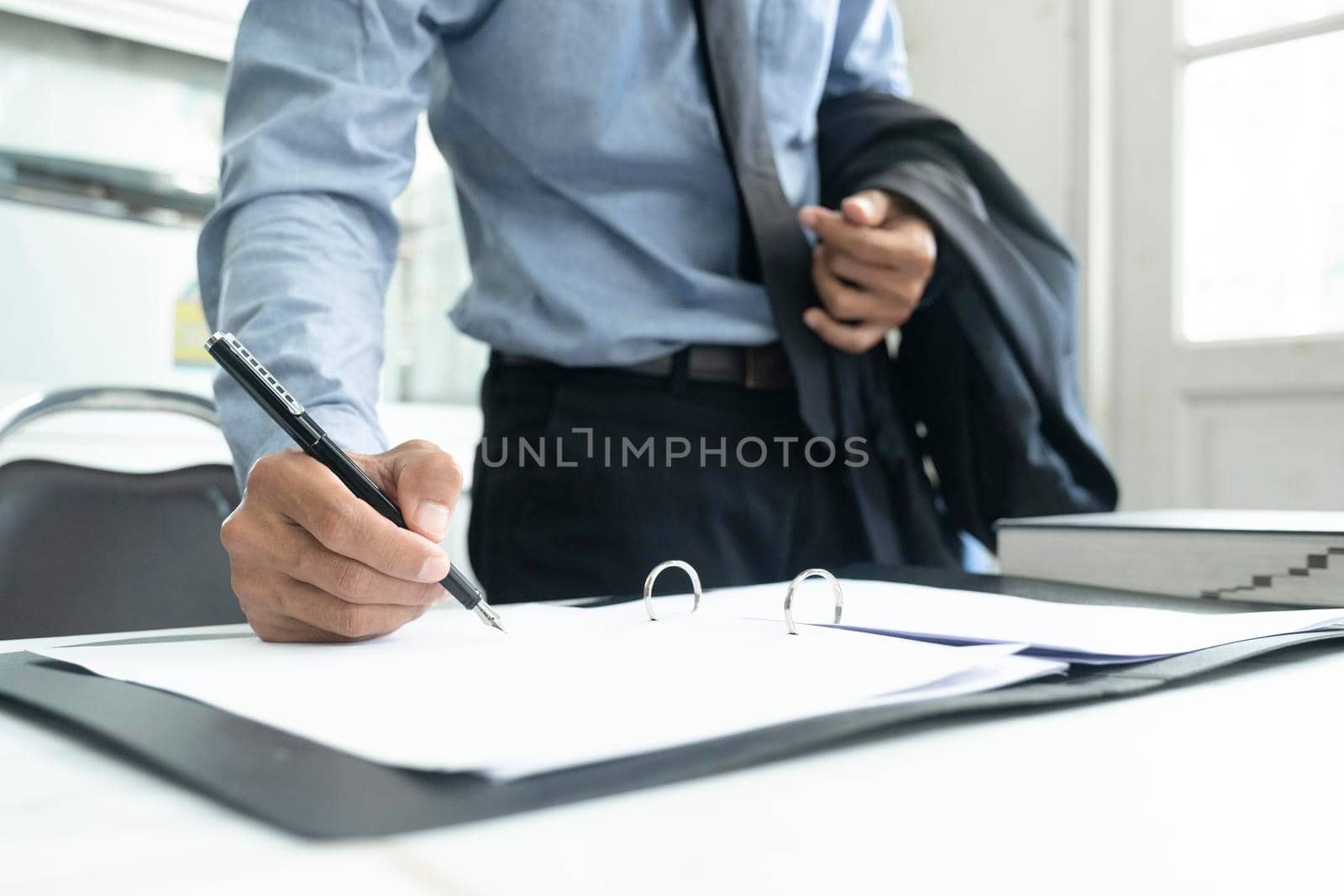 Close Up Of Businessman Signing A Contract.