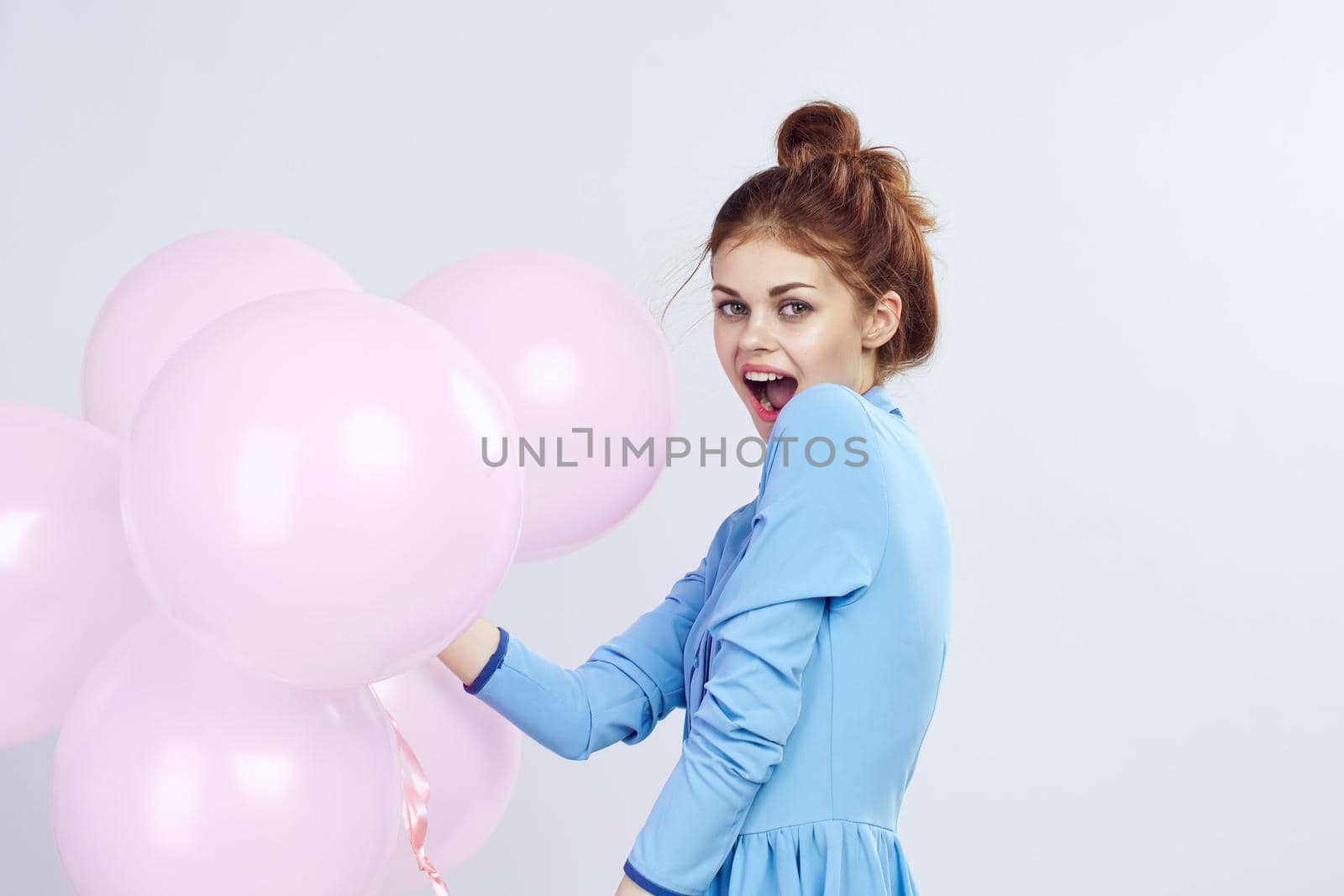 pretty woman with pigtails decoration holiday fun light background. High quality photo