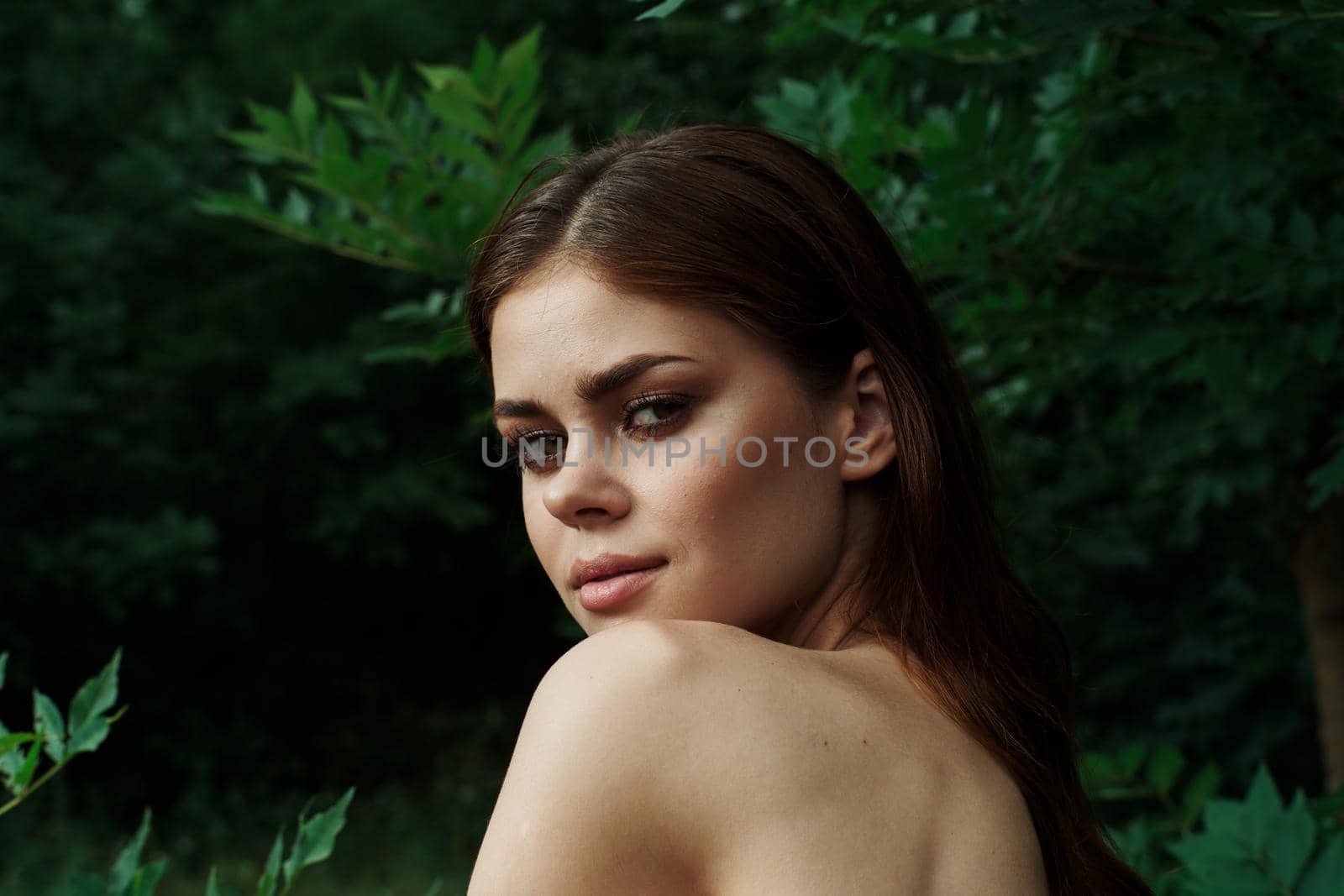 pretty woman Cosmetology nature green leaves glamor cropped view. High quality photo
