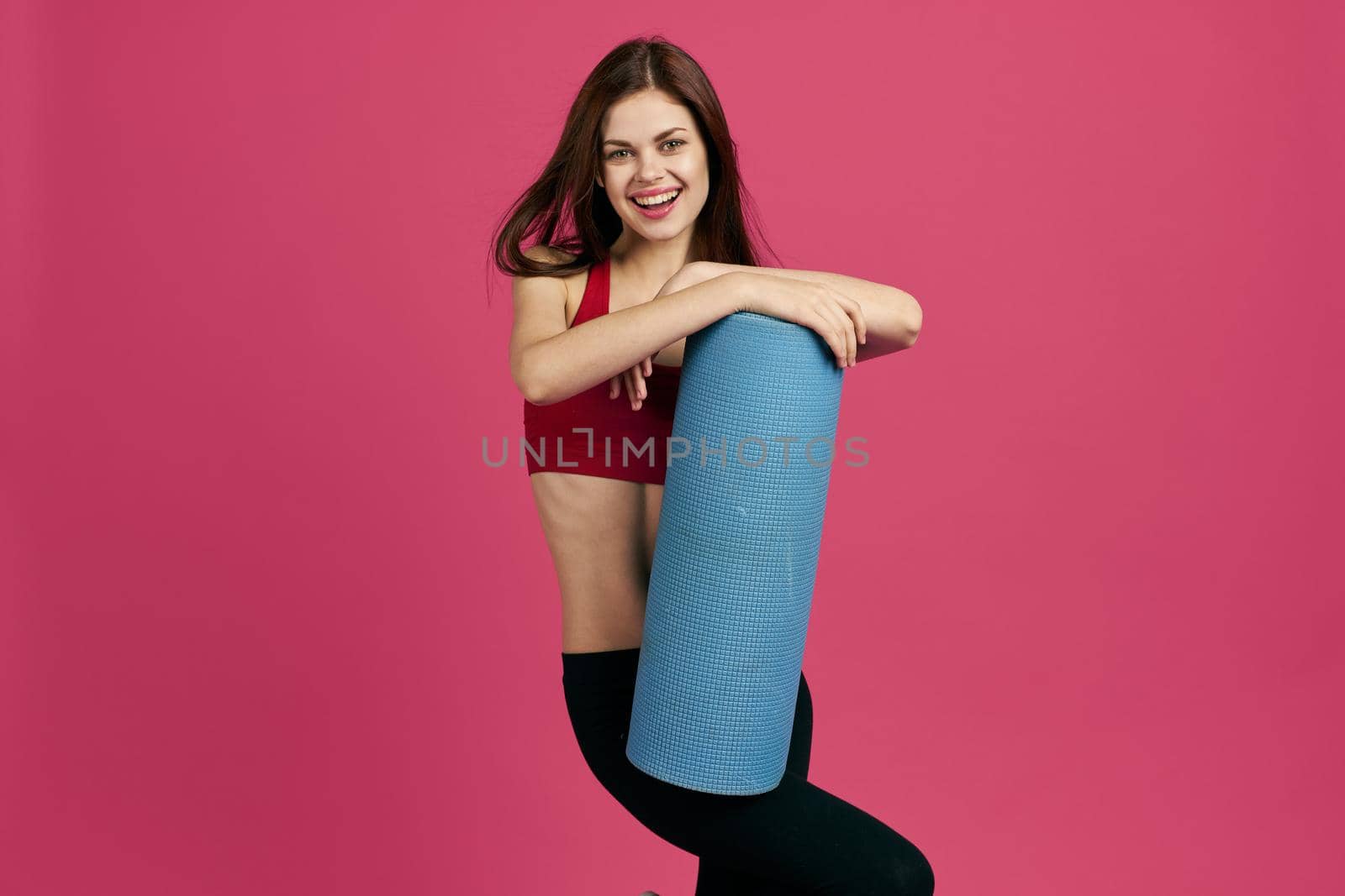 cheerful sportswoman workout health slim figure isolated background. High quality photo