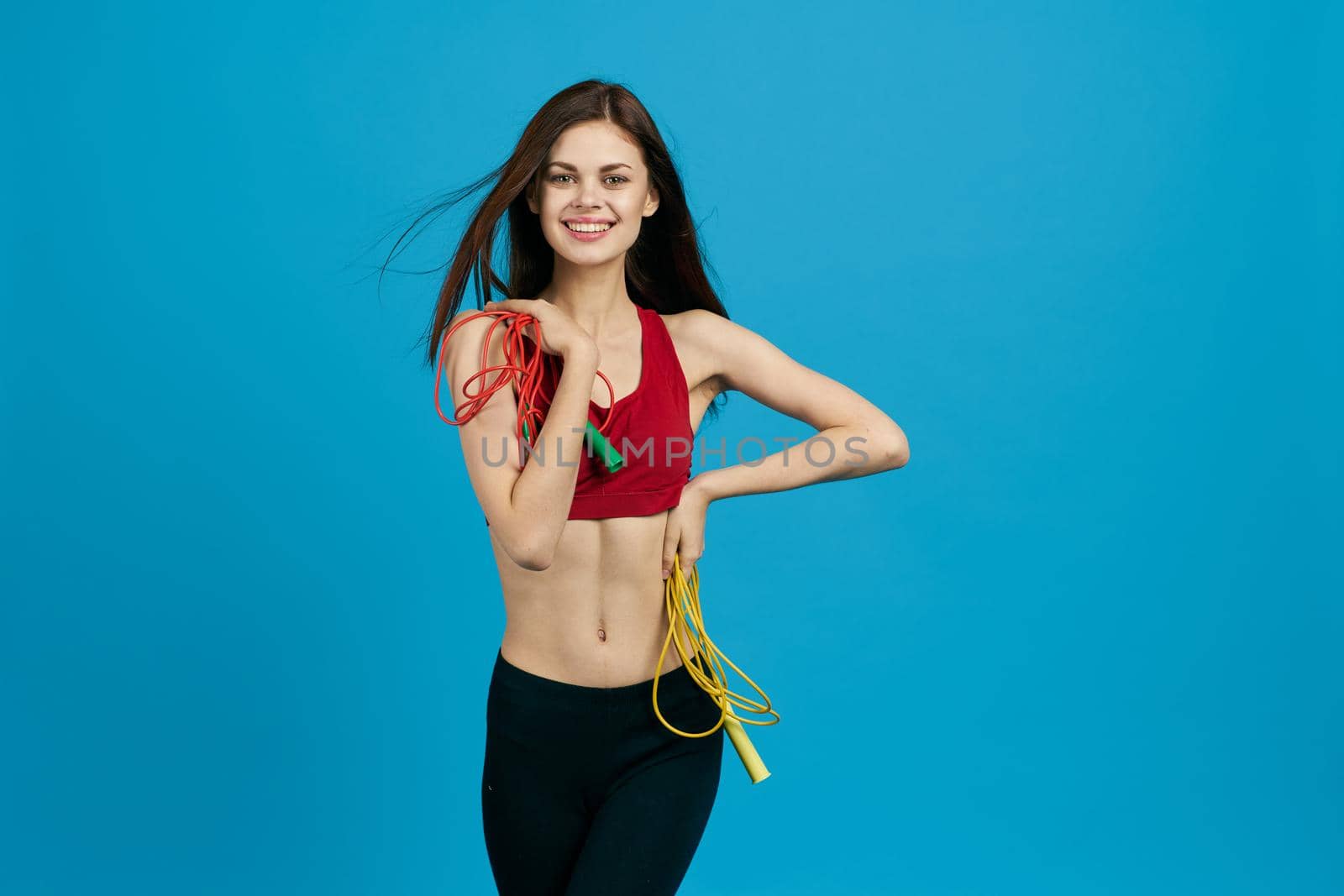 cheerful sportswoman sport equipment training isolated background by Vichizh
