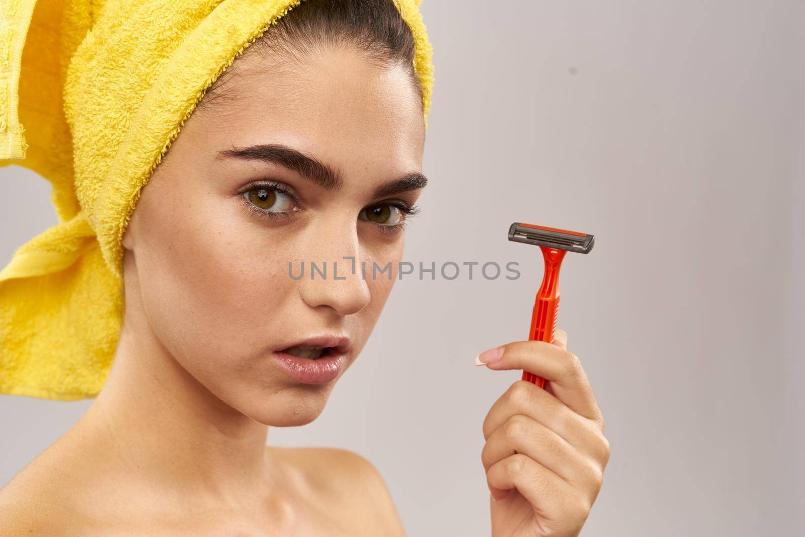 cheerful woman razor in hand skin care hygiene isolated background. High quality photo