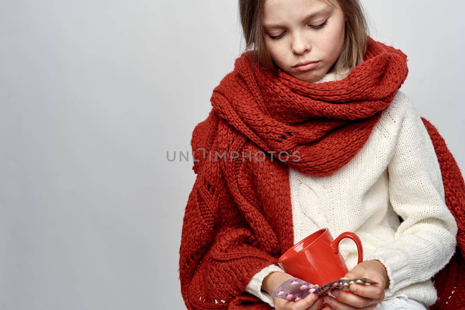 girl with a cold covered herself with a blanket health problems flu. High quality photo