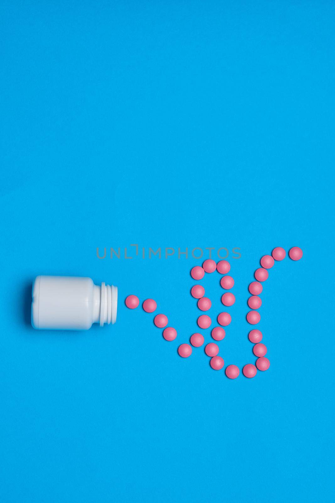 pain reliever vitamins capsules medicine blue background by Vichizh