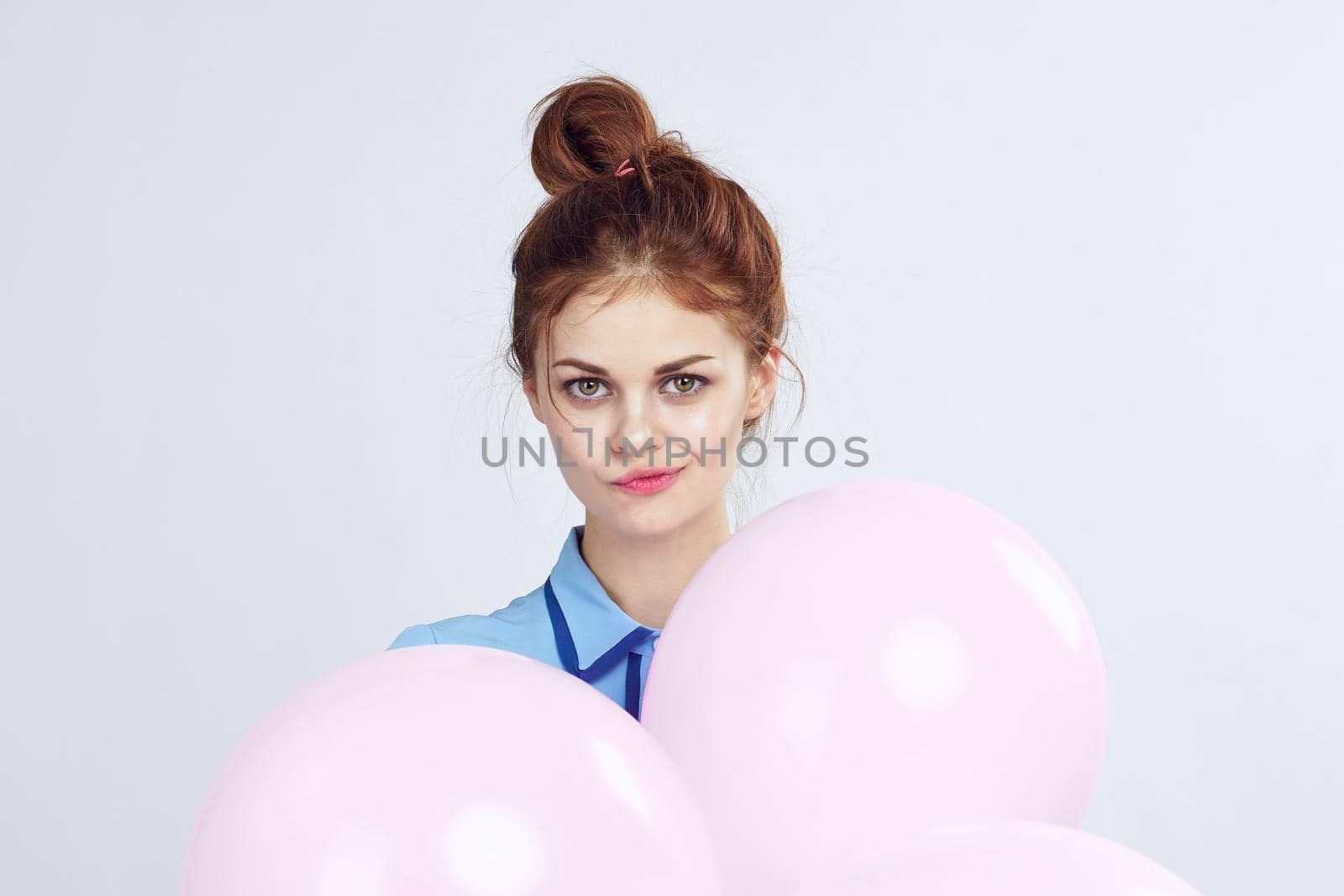 pretty woman with pigtails decoration holiday fun light background. High quality photo