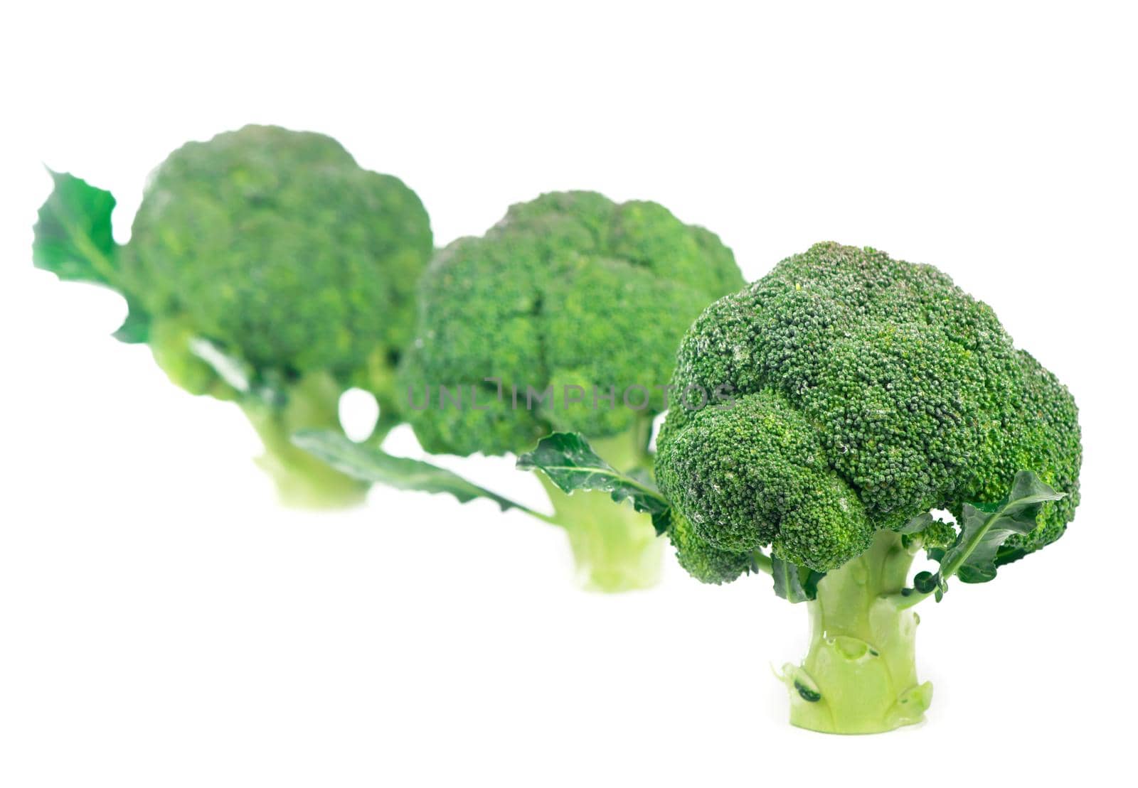 Fresh green broccoli on white background. Organic food by aprilphoto