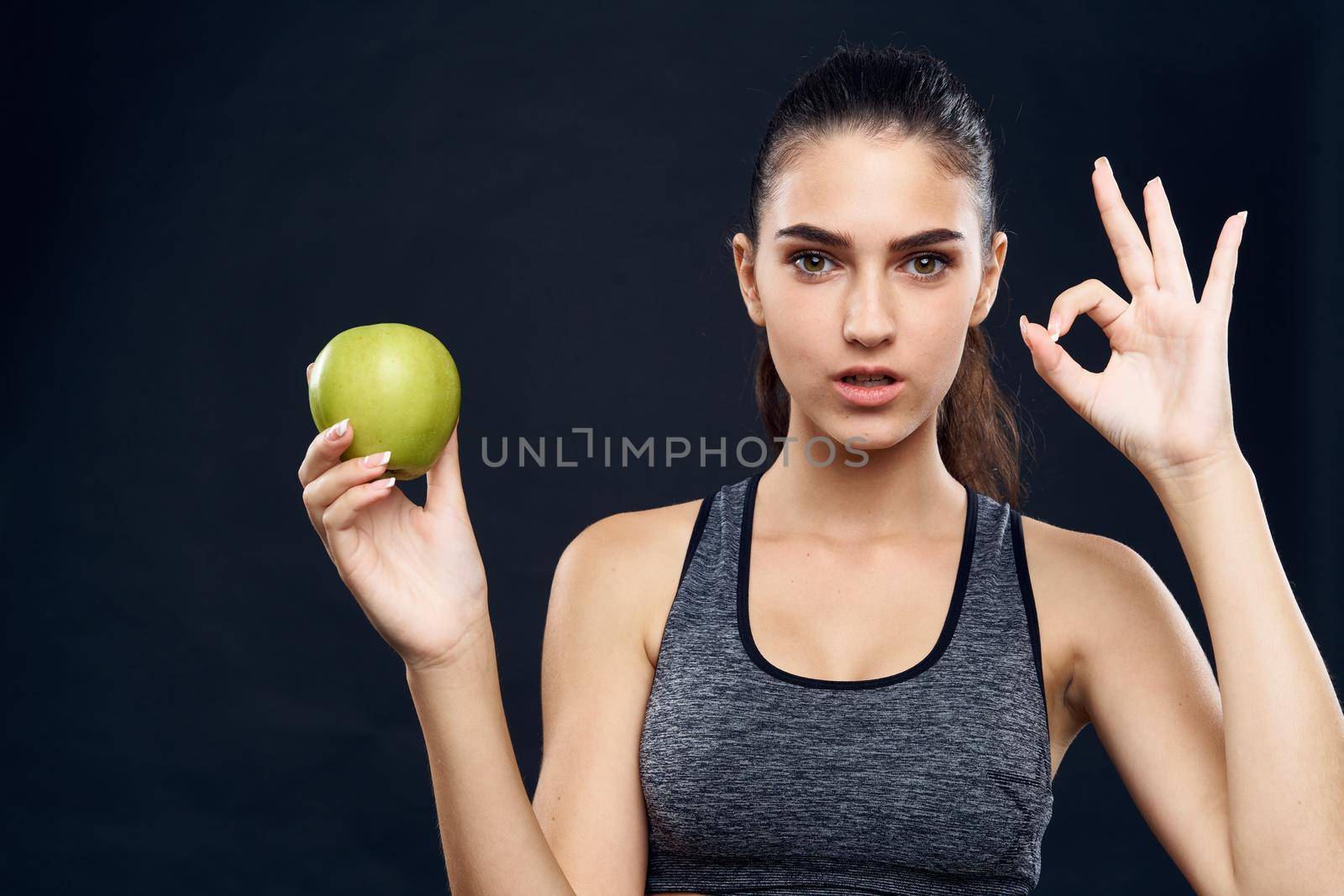 athletic woman slim figure green apple health by Vichizh