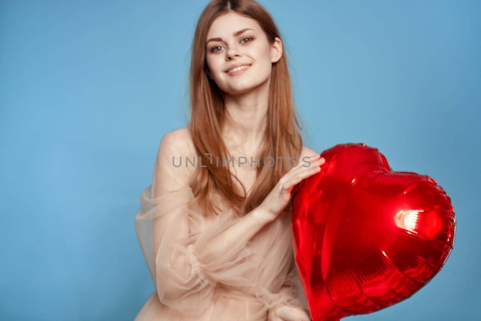 beautiful woman red heart in the hands of the balloon isolated background by Vichizh