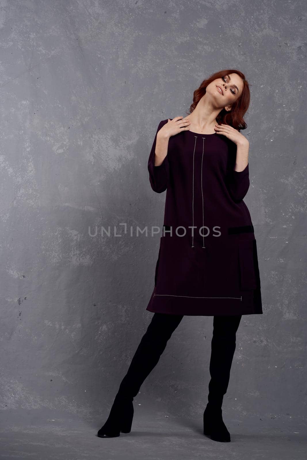 woman with red hair posing fashionable clothing elegant style. High quality photo