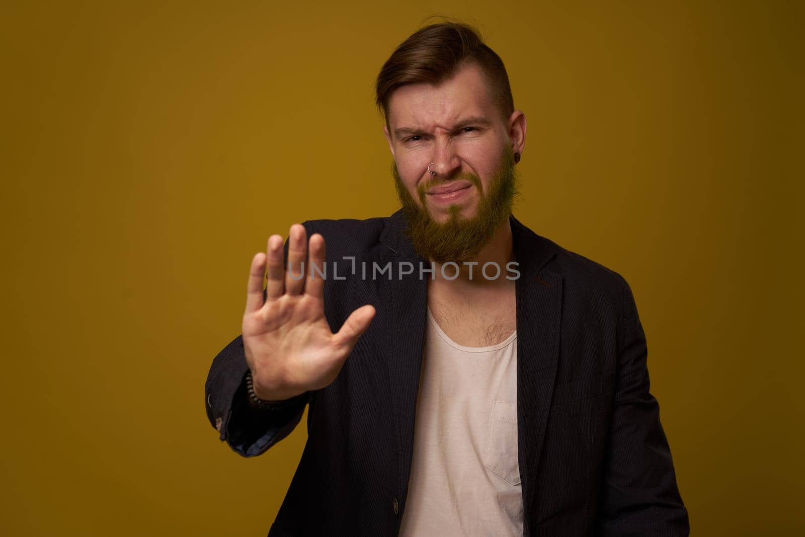 dealing with a serious expression in a black jacket emotions. High quality photo