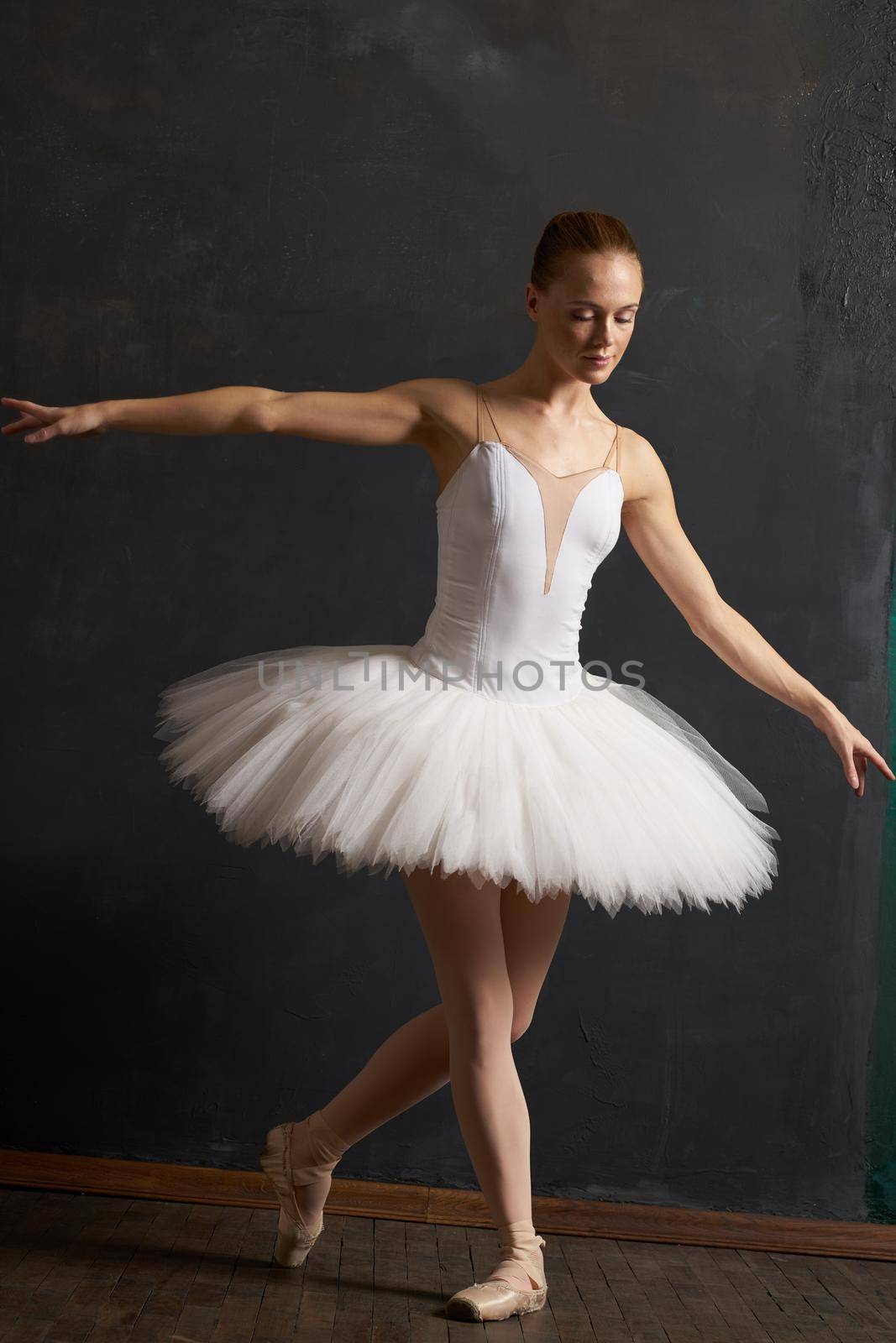 woman ballerina in white tutu performance grace dance. High quality photo