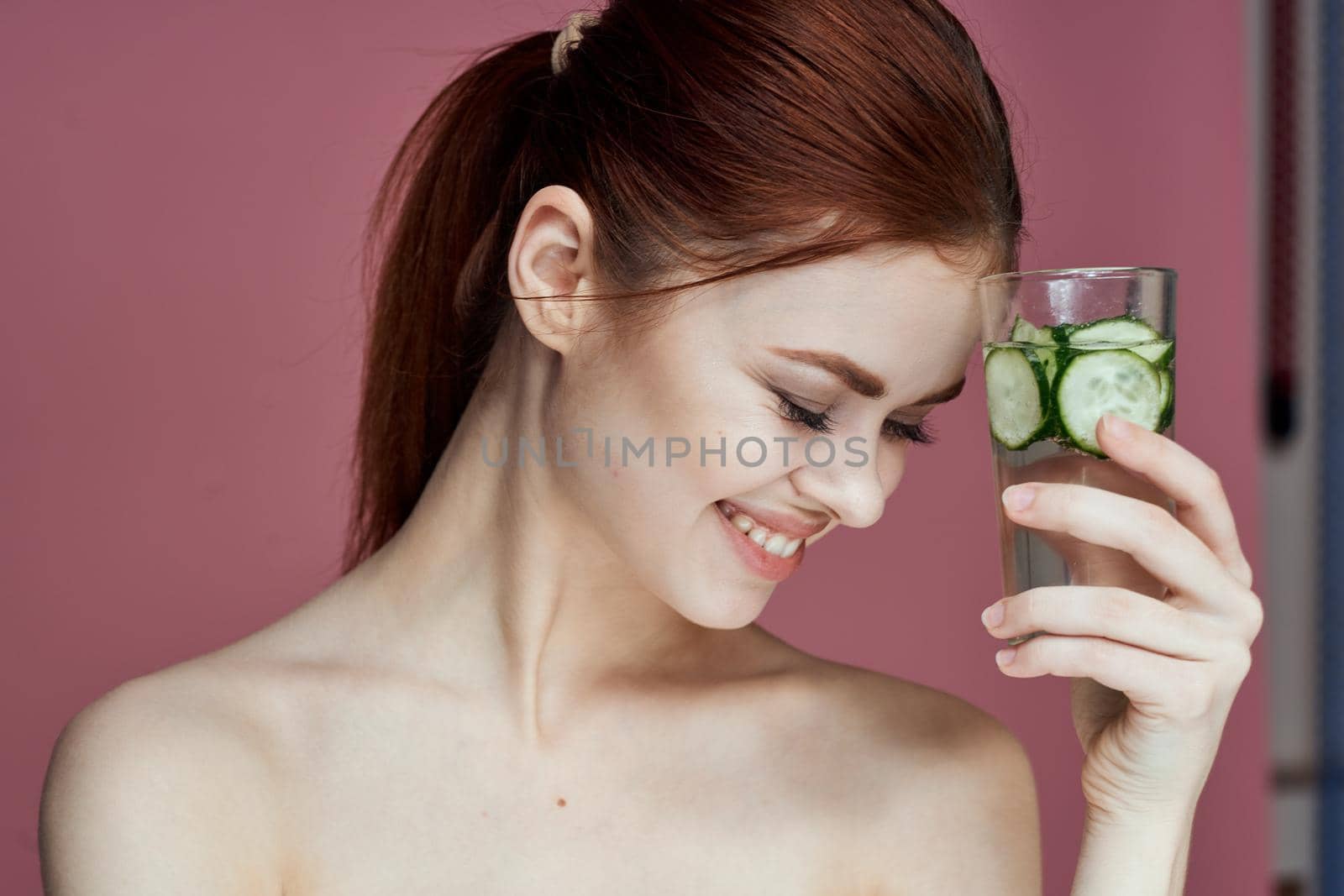 pretty woman with cucumber drink vitamins health beauty. High quality photo