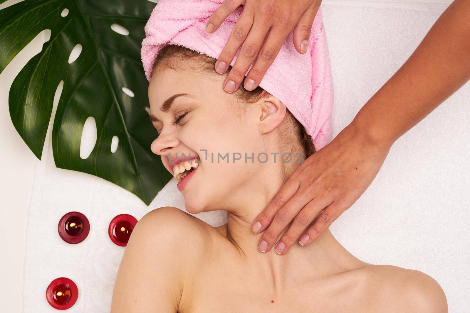 woman with pink towel on her head body care clean skin health. High quality photo