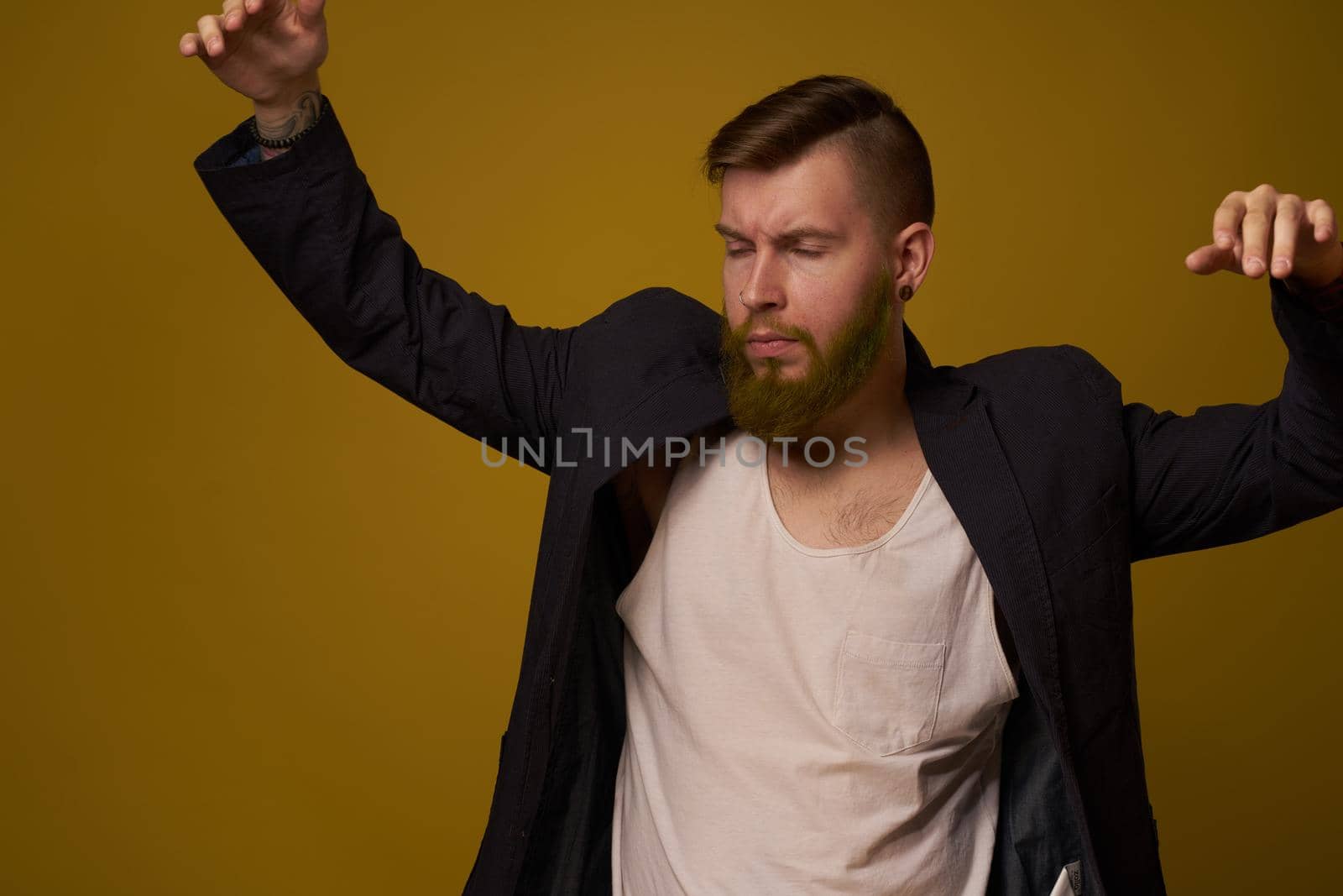 bearded man fashionable hairstyle jacket posing self confidence by Vichizh
