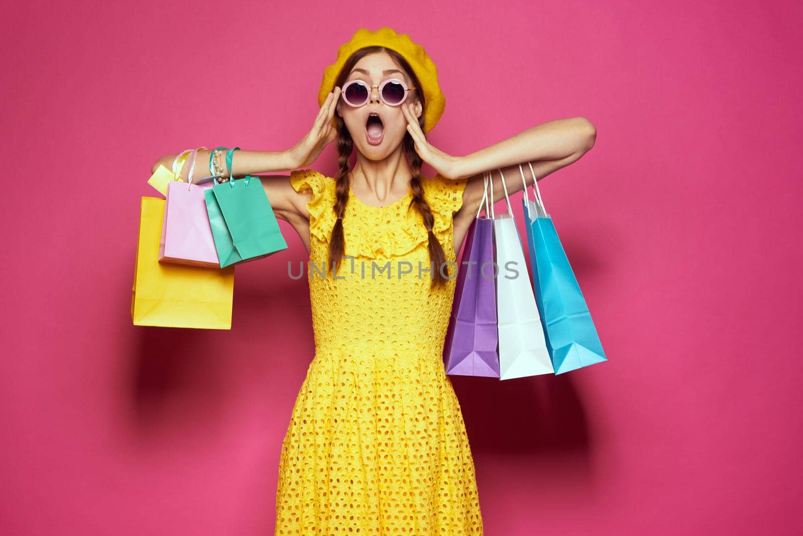 pretty woman yellow dress shopping fun isolated background. High quality photo