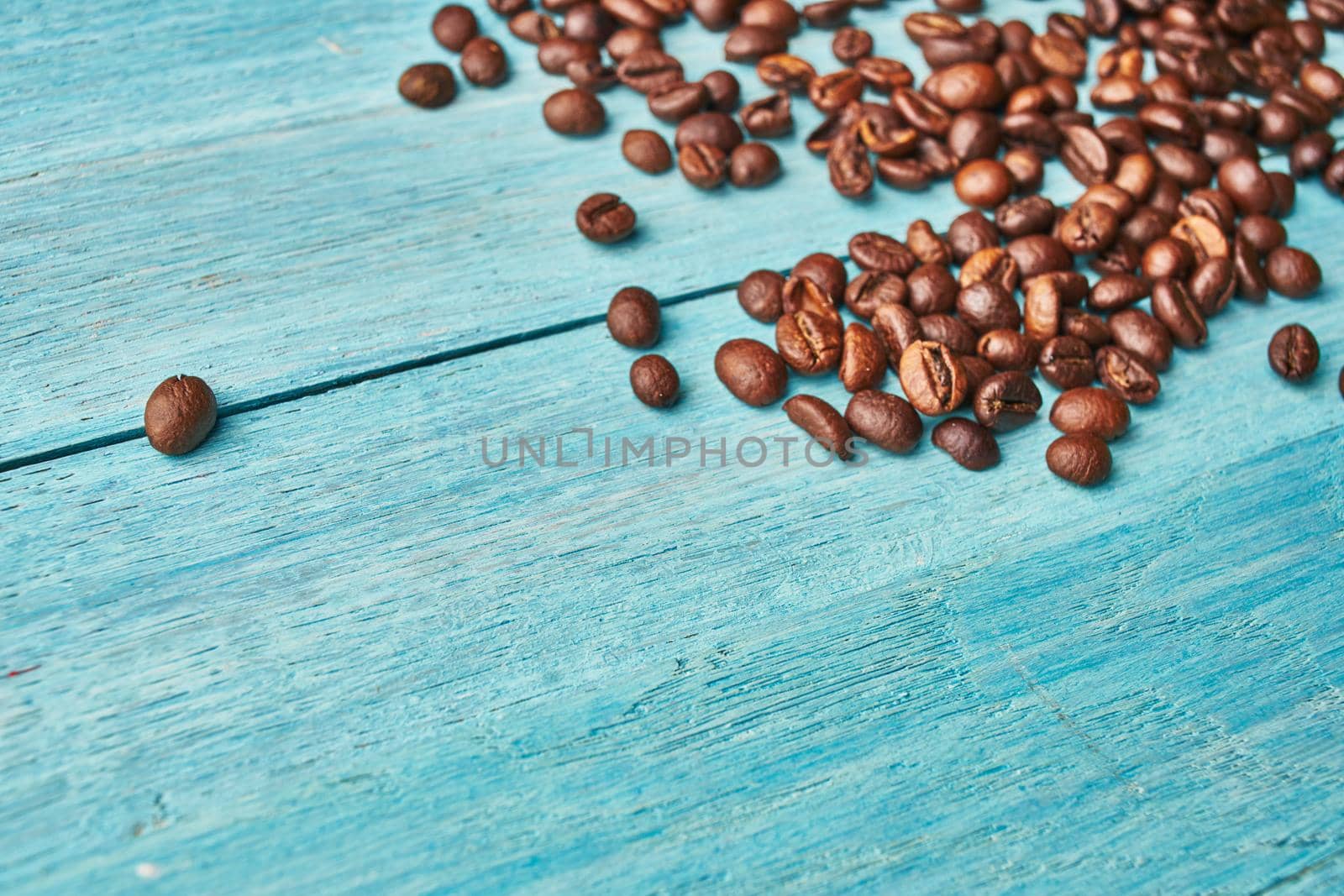 natural coffee brown mocha beans wooden table by Vichizh