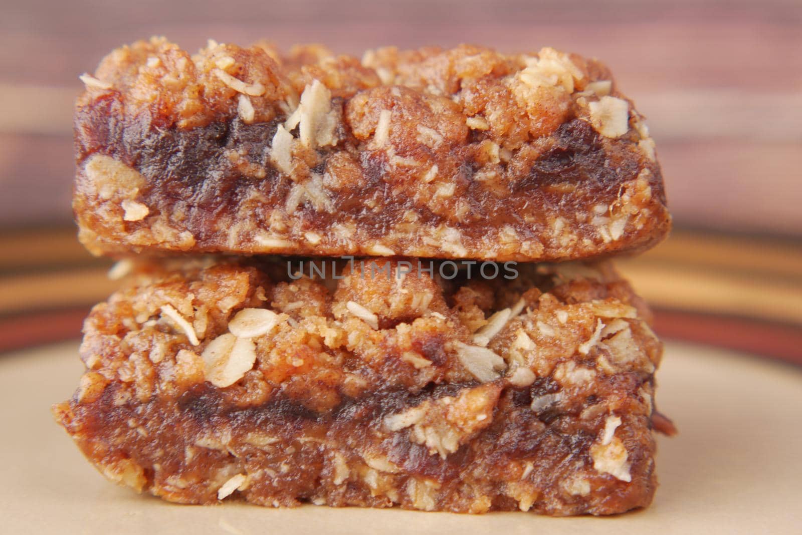 date fruit chocolate bar in a plate on table .