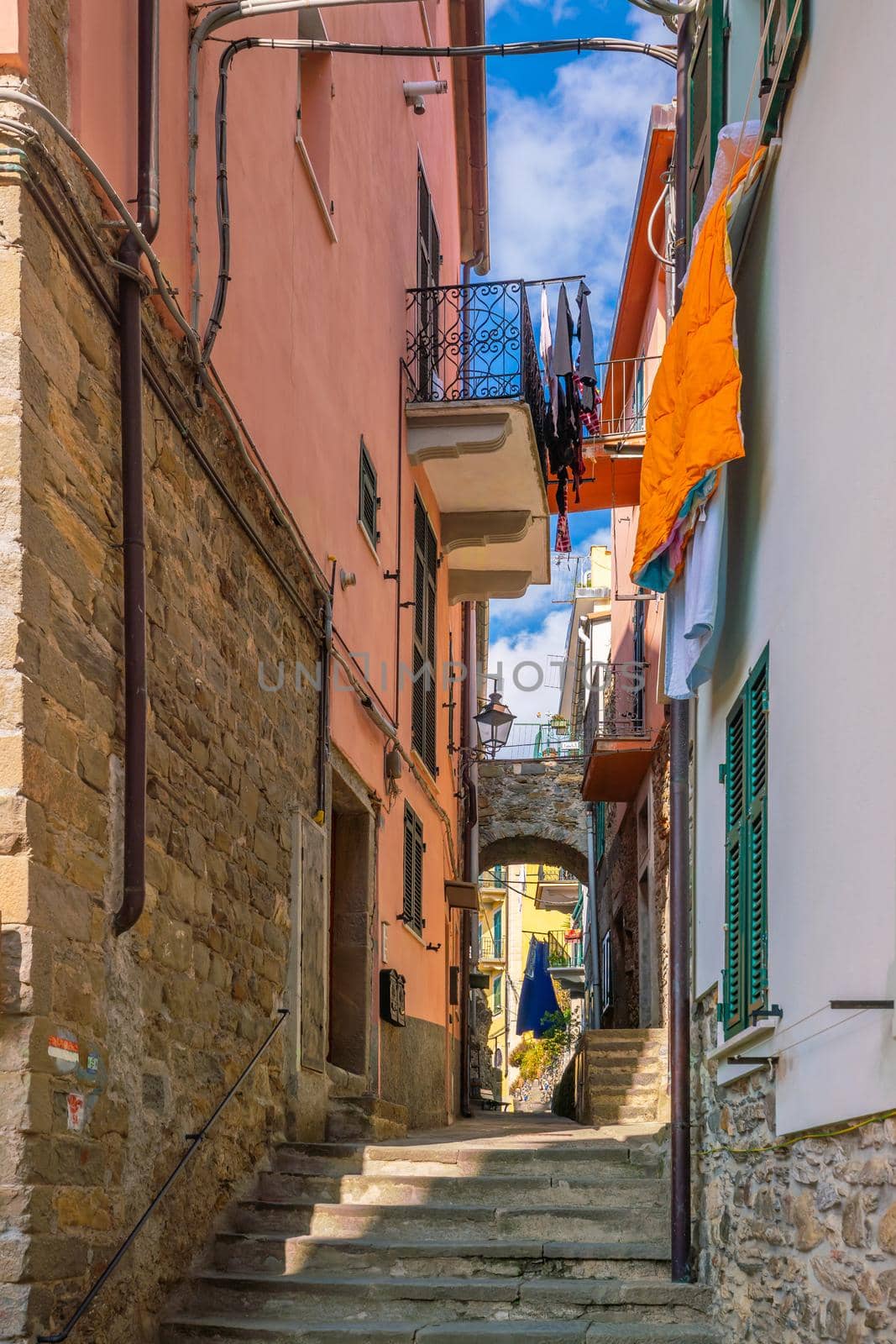 Corniglia, Colorful cityscape on the mountains over Mediterranean sea in Cinque Terre Italy by f11photo
