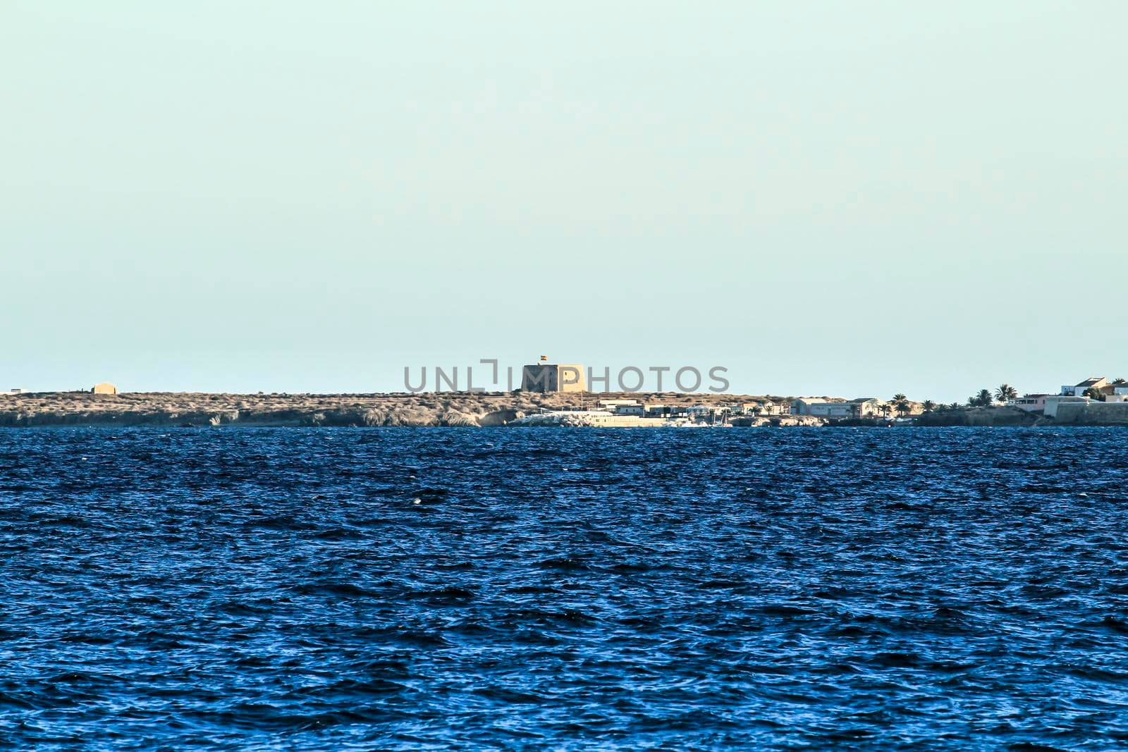 Tabarca Island and mediterranean sea under the sun in the morning