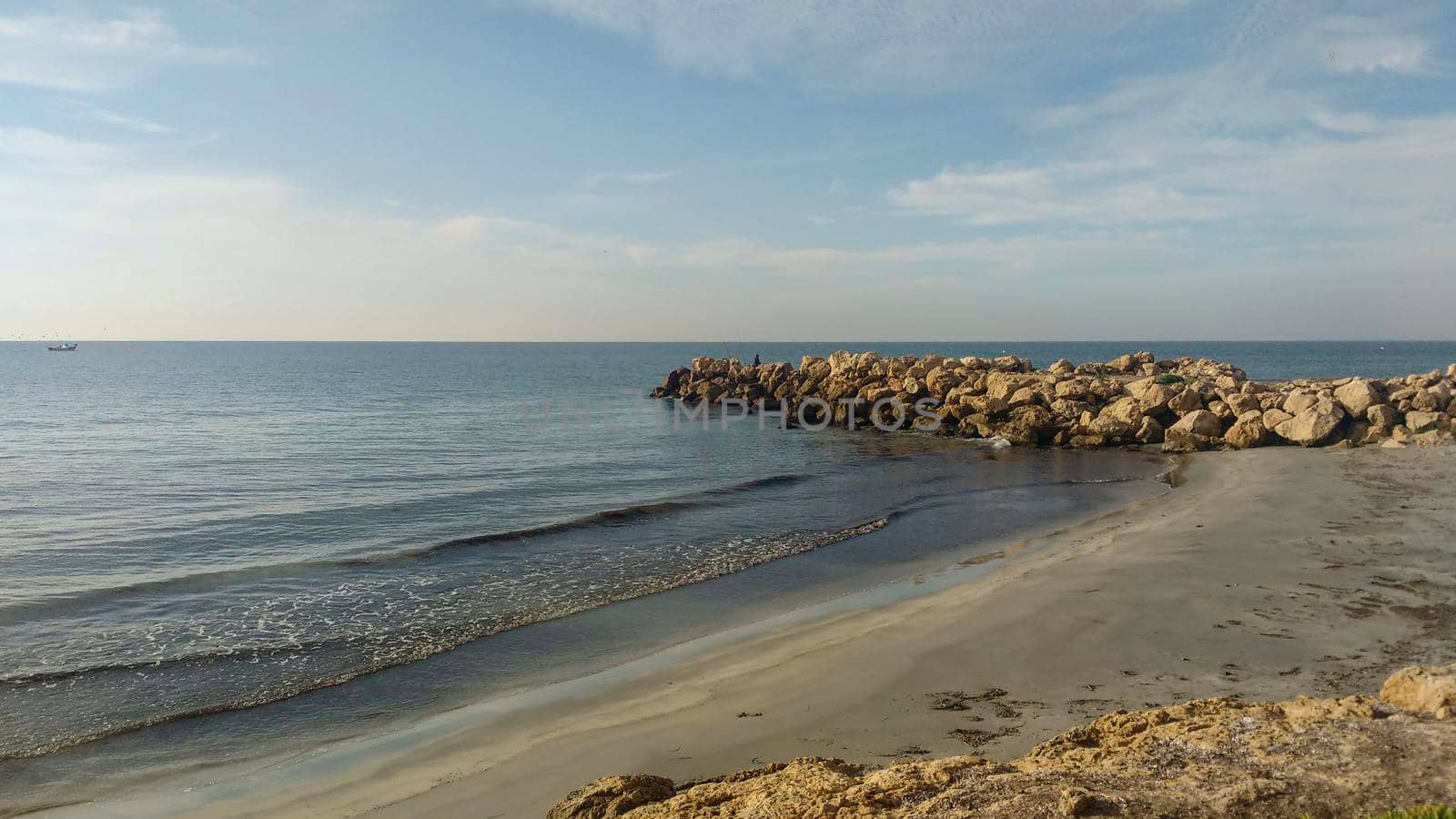 Beach and cloudy sky in the morning in Santa Pola, a small fishing village in southern Spain