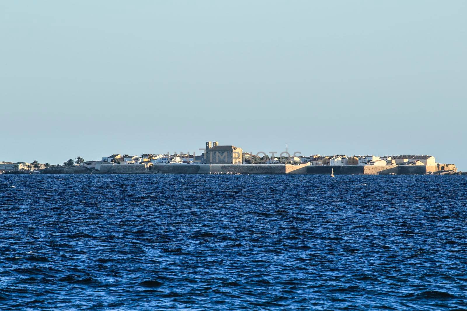 Tabarca Island and mediterranean sea under the sun in the morning