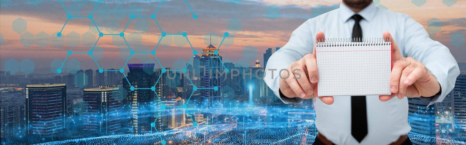 Businessman Holding Notebook With Both Hands Around Futuristic Technology.