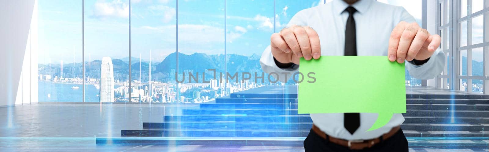 Man Wearing Black Tie Holding Empty Page Chat Box Around Futuristic Technology. Employee Presenting Blank Workbook Surrounded By Modern Automation. by nialowwa