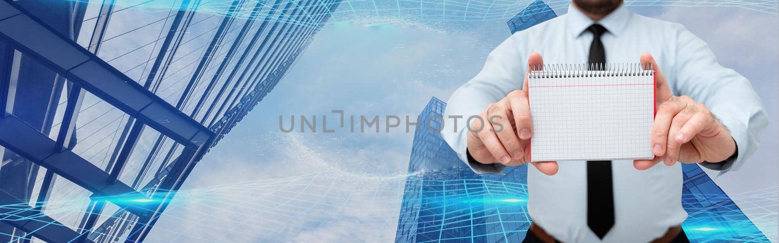 Businessman Holding Empty Page Graphing Notebook With His Both Hands Around Futuristic Technology. Employee Presenting Blank Workbook Surrounded By Modern Automation. by nialowwa