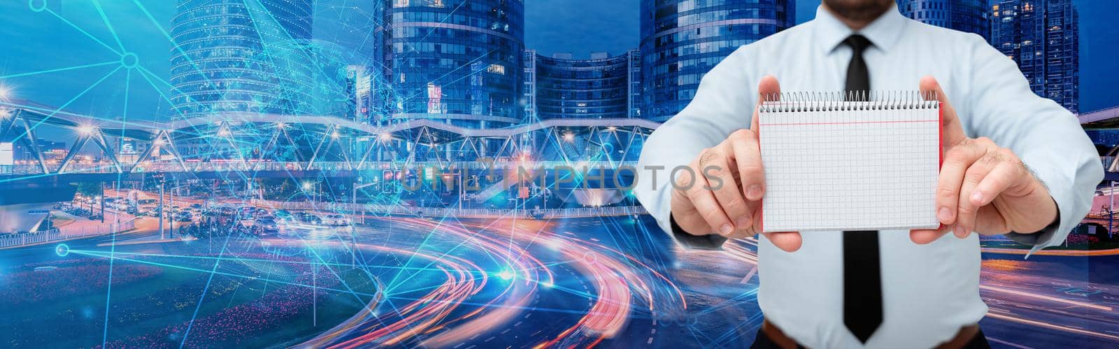 Businessman Holding Notebook With Both Hands Around Futuristic Technology.