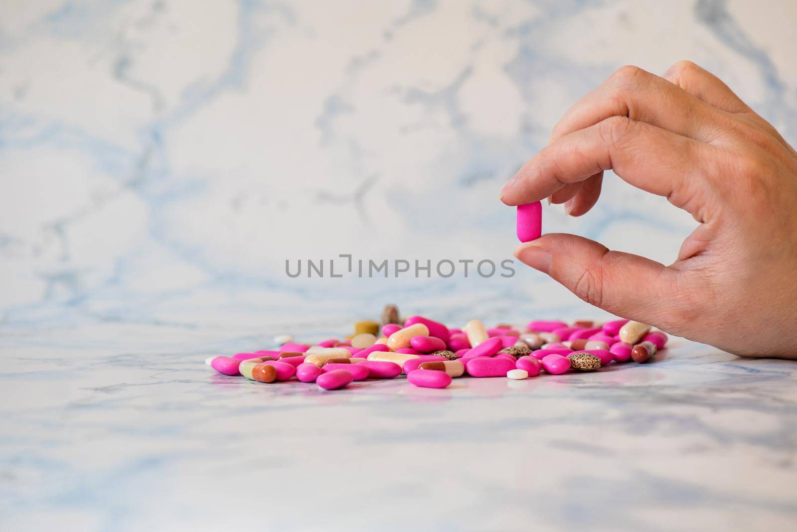 Shot of tablet in the fingers of hand by anytka