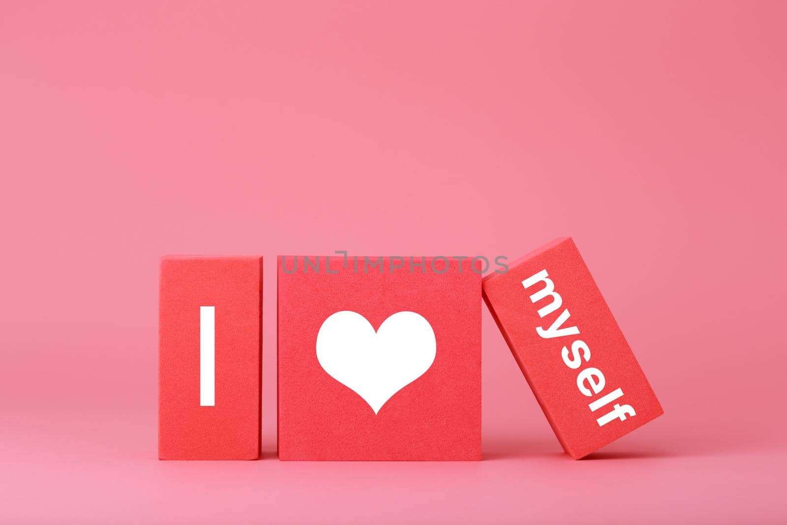 I love myself modern minimal concept in pink and red colors. Simple elegant composition with toy cubes by Senorina_Irina