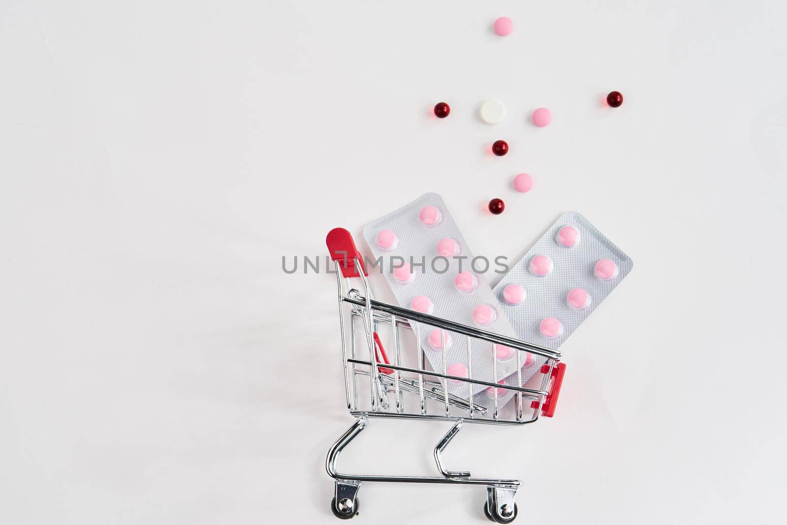 drug trolleys pharmacy shopping light background pharmacy. High quality photo