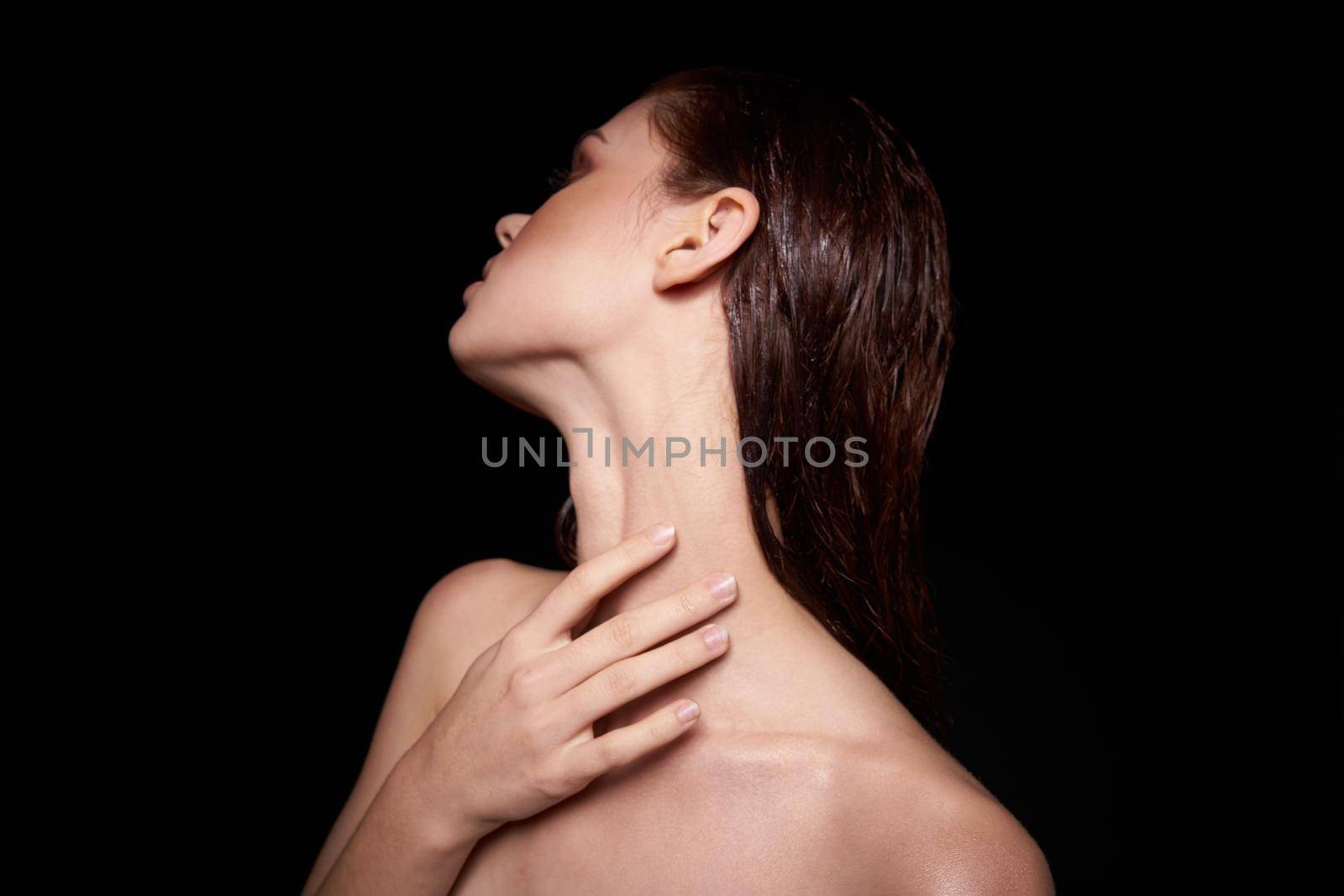 beautiful woman emotions gesture hands bare shoulders dark background. High quality photo