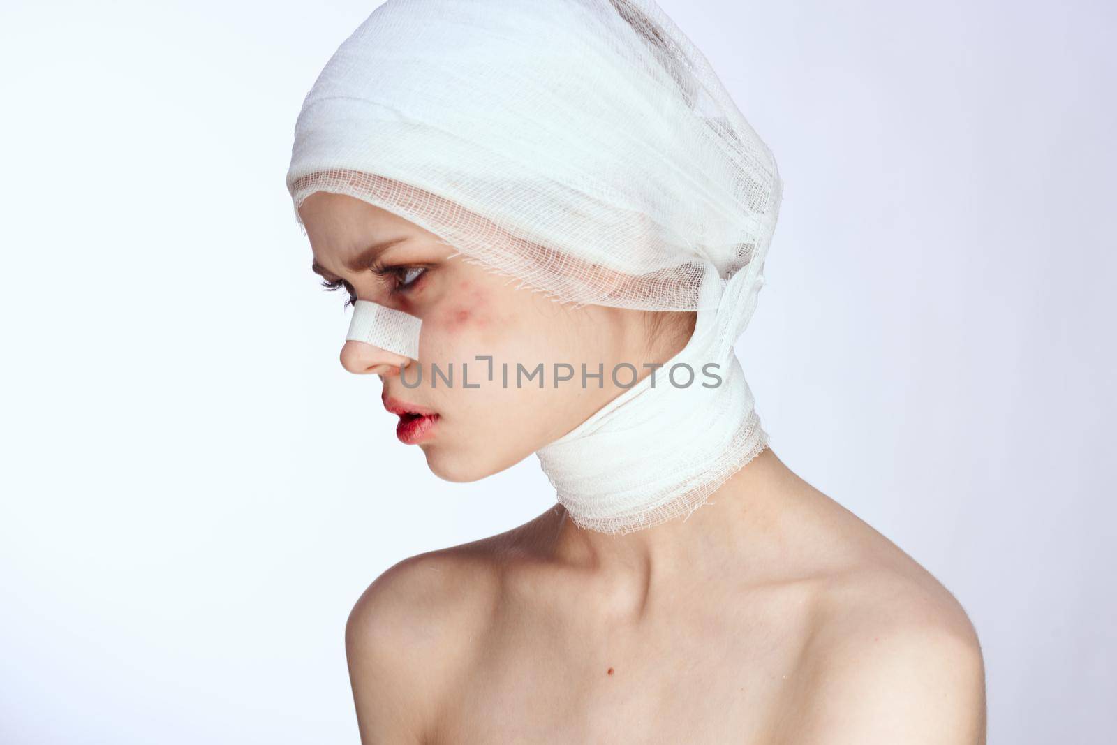 a person plastic surgery operation bare shoulders light background. High quality photo