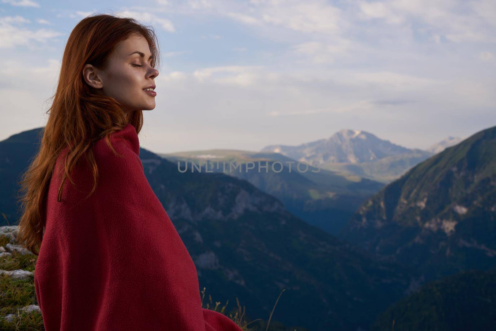woman with red plaid on nature in the mountains vacation adventure. High quality photo