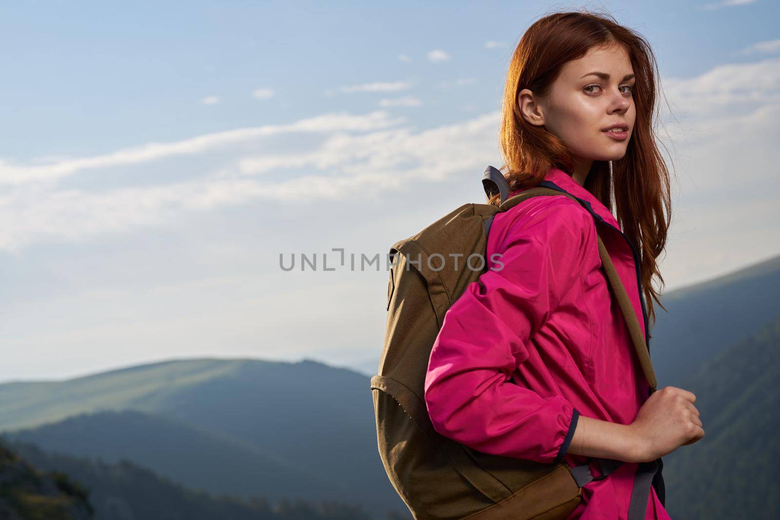 woman hiker outdoors in the mountains landscape fresh air by Vichizh