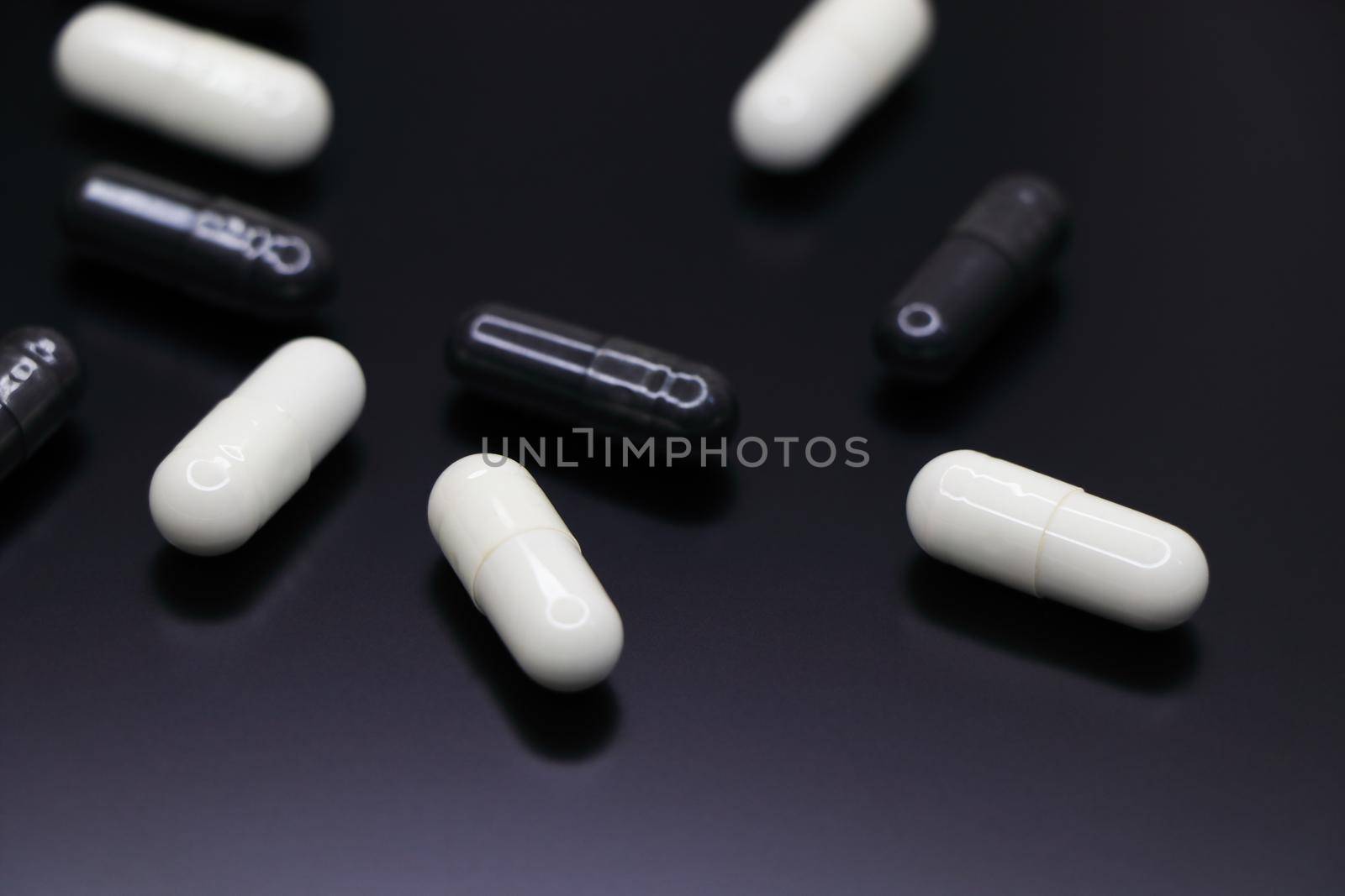 White And Black Drug Gel Capsules Abstract by jjvanginkel