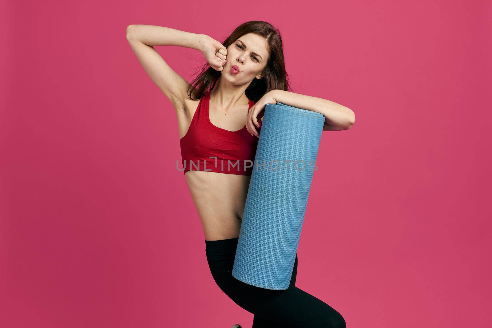 athletic woman workout health slim figure pink background. High quality photo