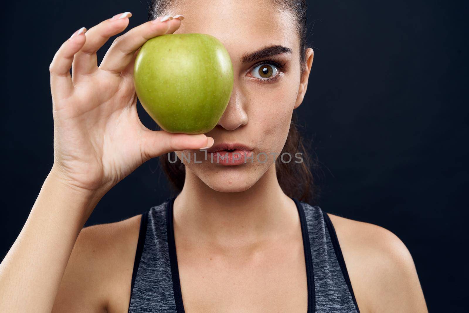 athletic woman slim figure green apple health. High quality photo